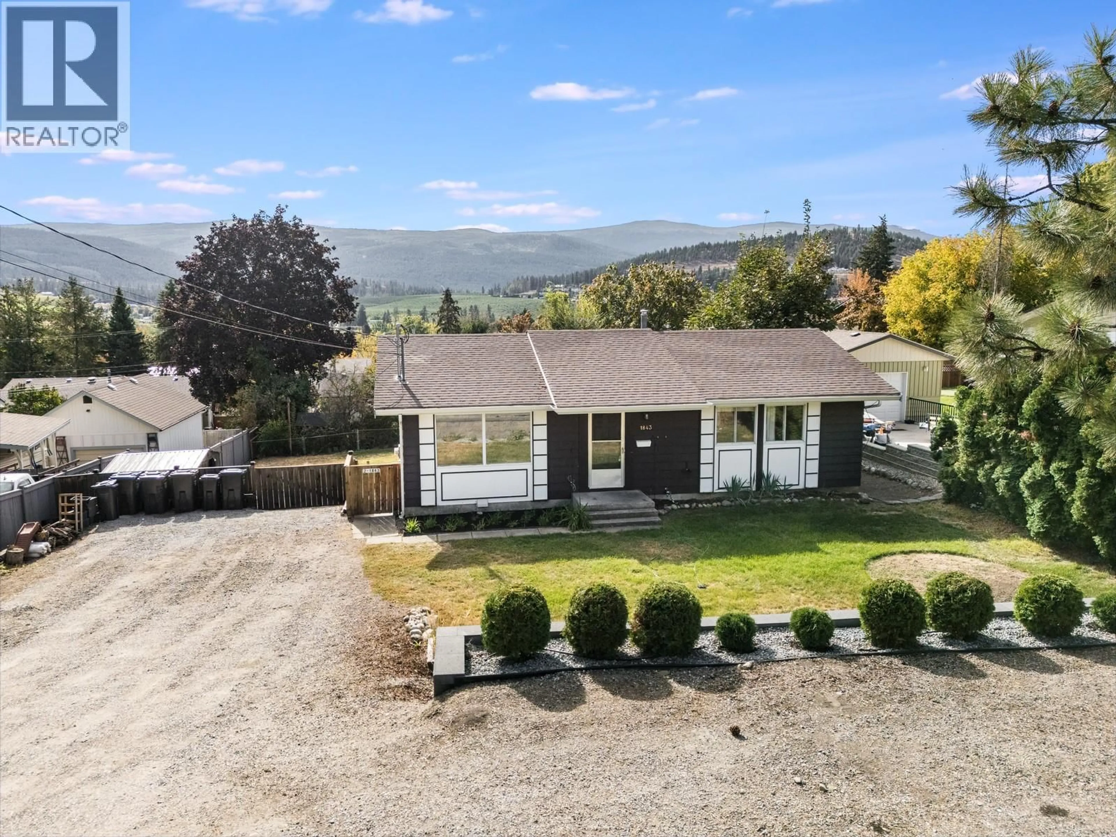 A pic from outside/outdoor area/front of a property/back of a property/a pic from drone, mountain view for 1843 GOLBECK COURT, Kelowna British Columbia V1P1L7