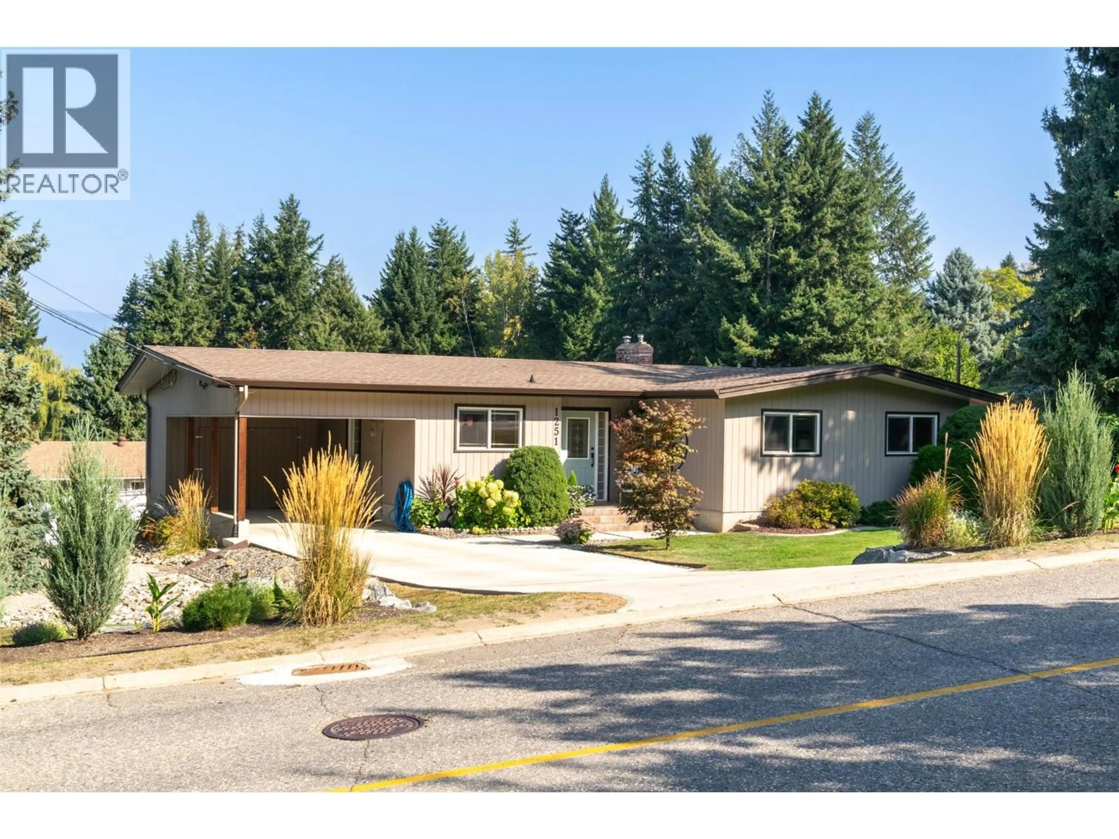Home with vinyl exterior material, street for 1251 12 AVENUE SOUTHEAST, Salmon Arm British Columbia V1E2C7