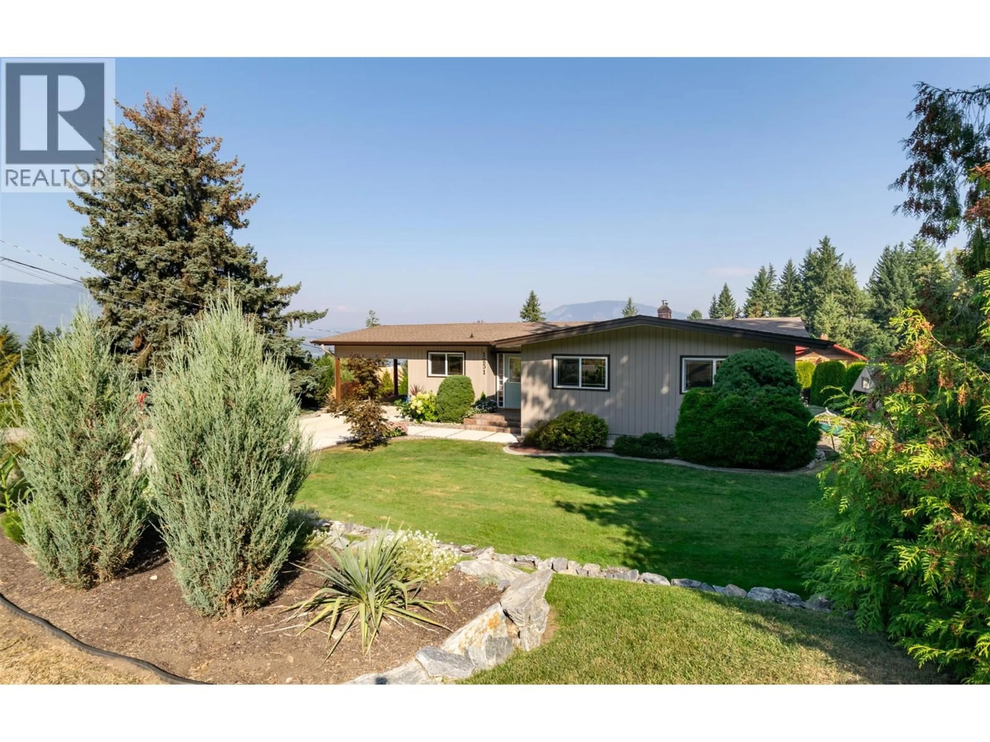 A pic from outside/outdoor area/front of a property/back of a property/a pic from drone, mountain view for 1251 12 AVENUE SOUTHEAST, Salmon Arm British Columbia V1E2C7