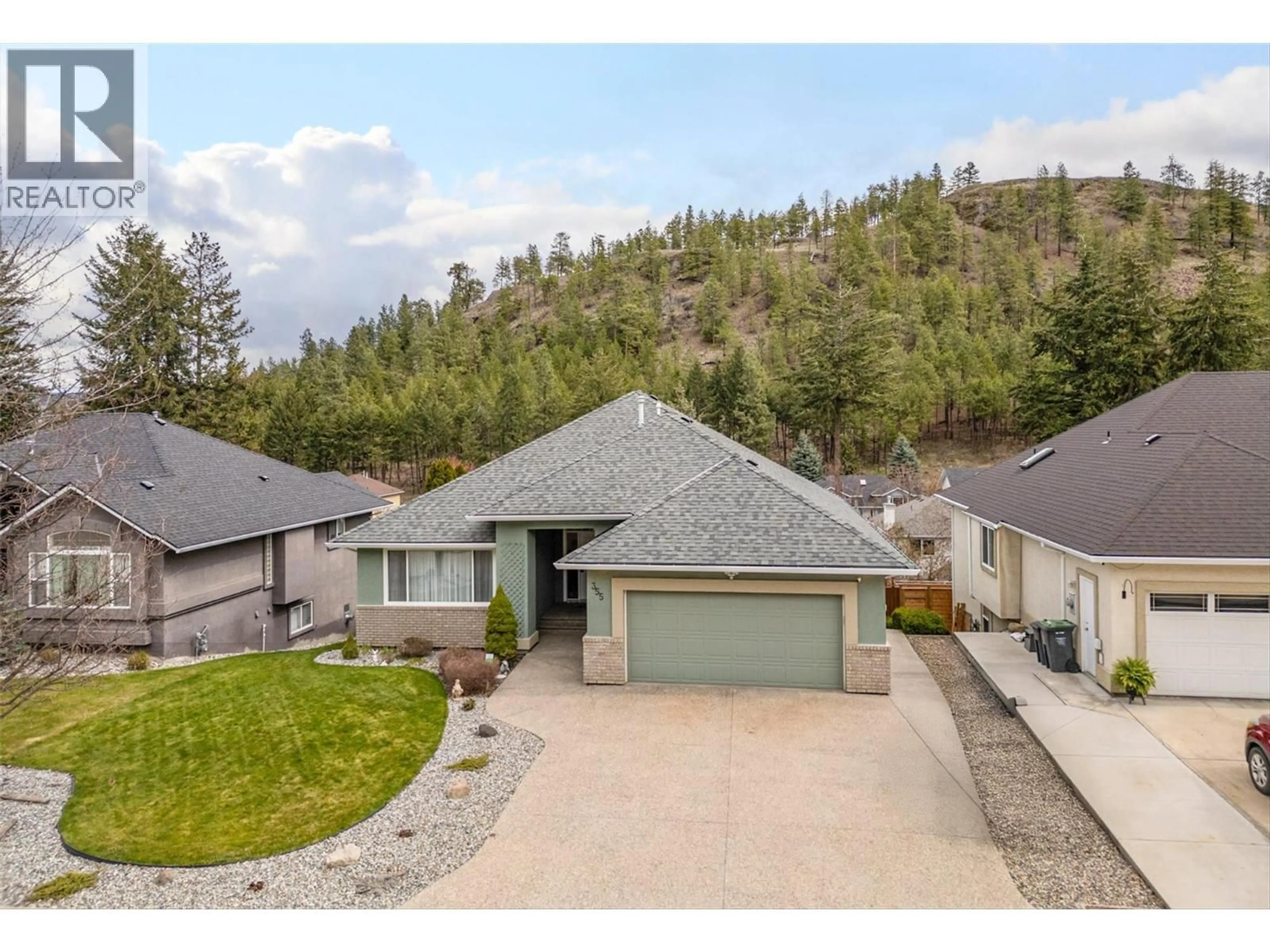 A pic from outside/outdoor area/front of a property/back of a property/a pic from drone, mountain view for 355 WOODPARK CRESCENT, Kelowna British Columbia V1V2L4