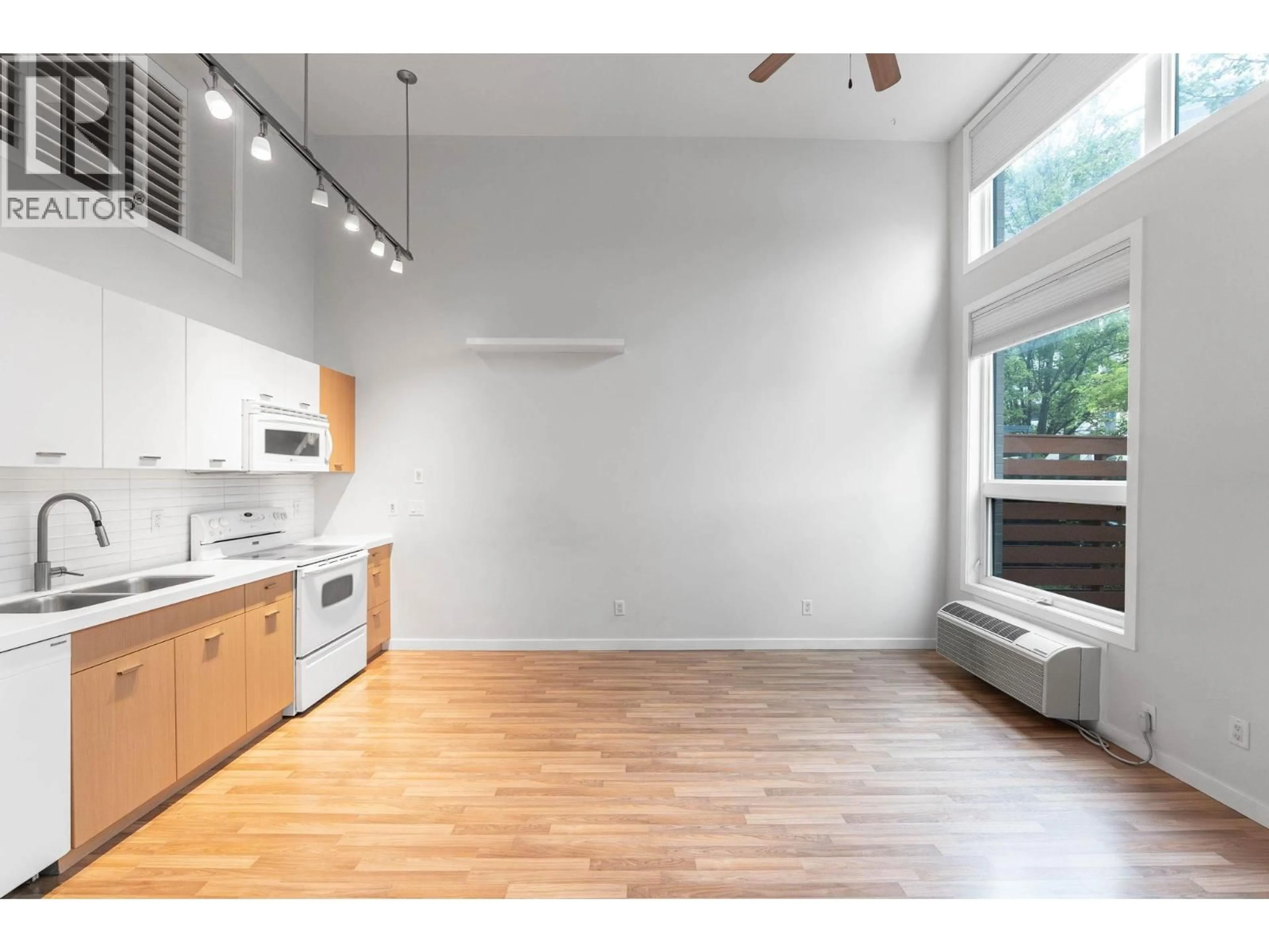 Open concept kitchen, wood/laminate floor for 7 - 1550 DICKSON AVENUE, Kelowna British Columbia V1Y9Y8