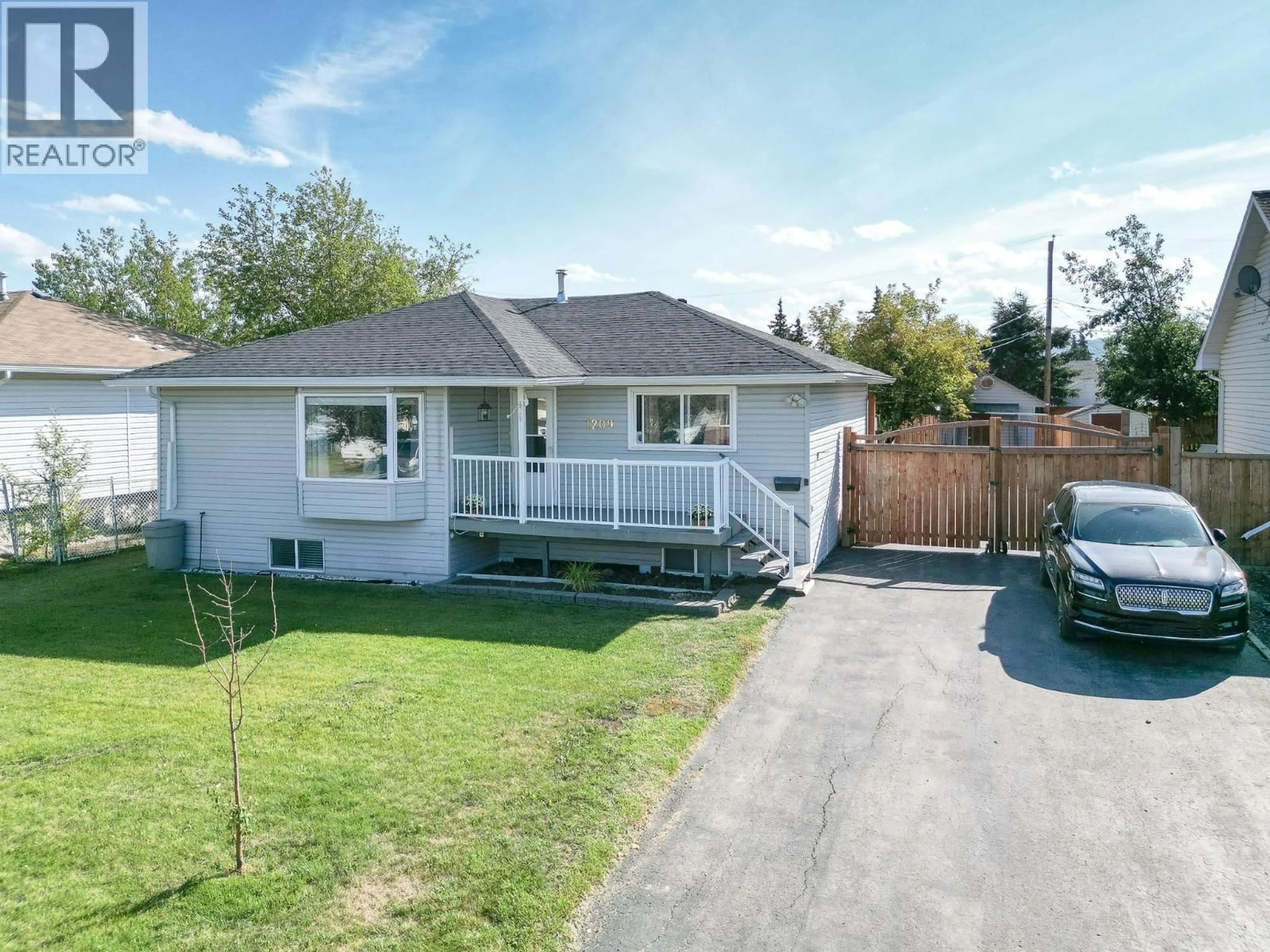 A pic from outside/outdoor area/front of a property/back of a property/a pic from drone, street for 1209 113 AVENUE, Dawson Creek British Columbia V1G2Y9