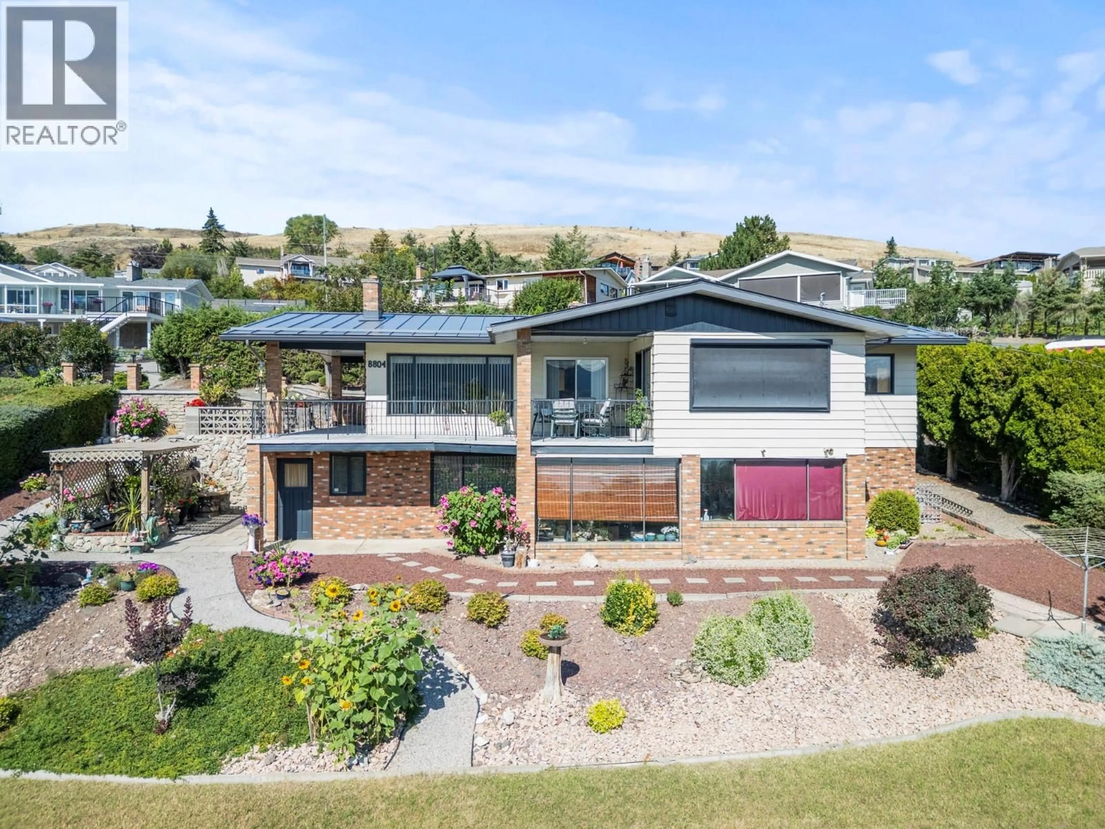 A pic from outside/outdoor area/front of a property/back of a property/a pic from drone, street for 8804 FITZMAURICE LANE, Vernon British Columbia V1B1X4