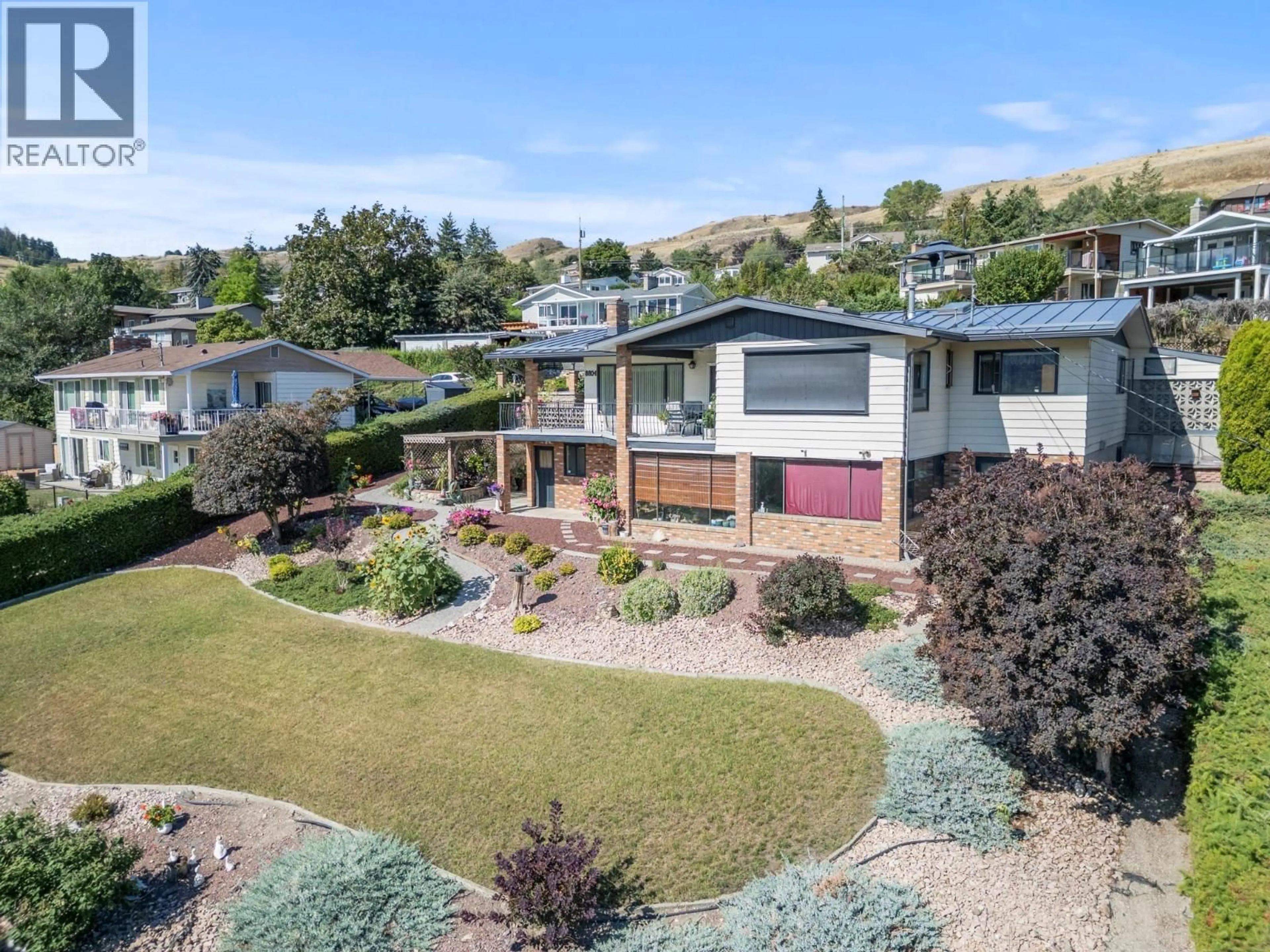 A pic from outside/outdoor area/front of a property/back of a property/a pic from drone, mountain view for 8804 FITZMAURICE LANE, Vernon British Columbia V1B1X4