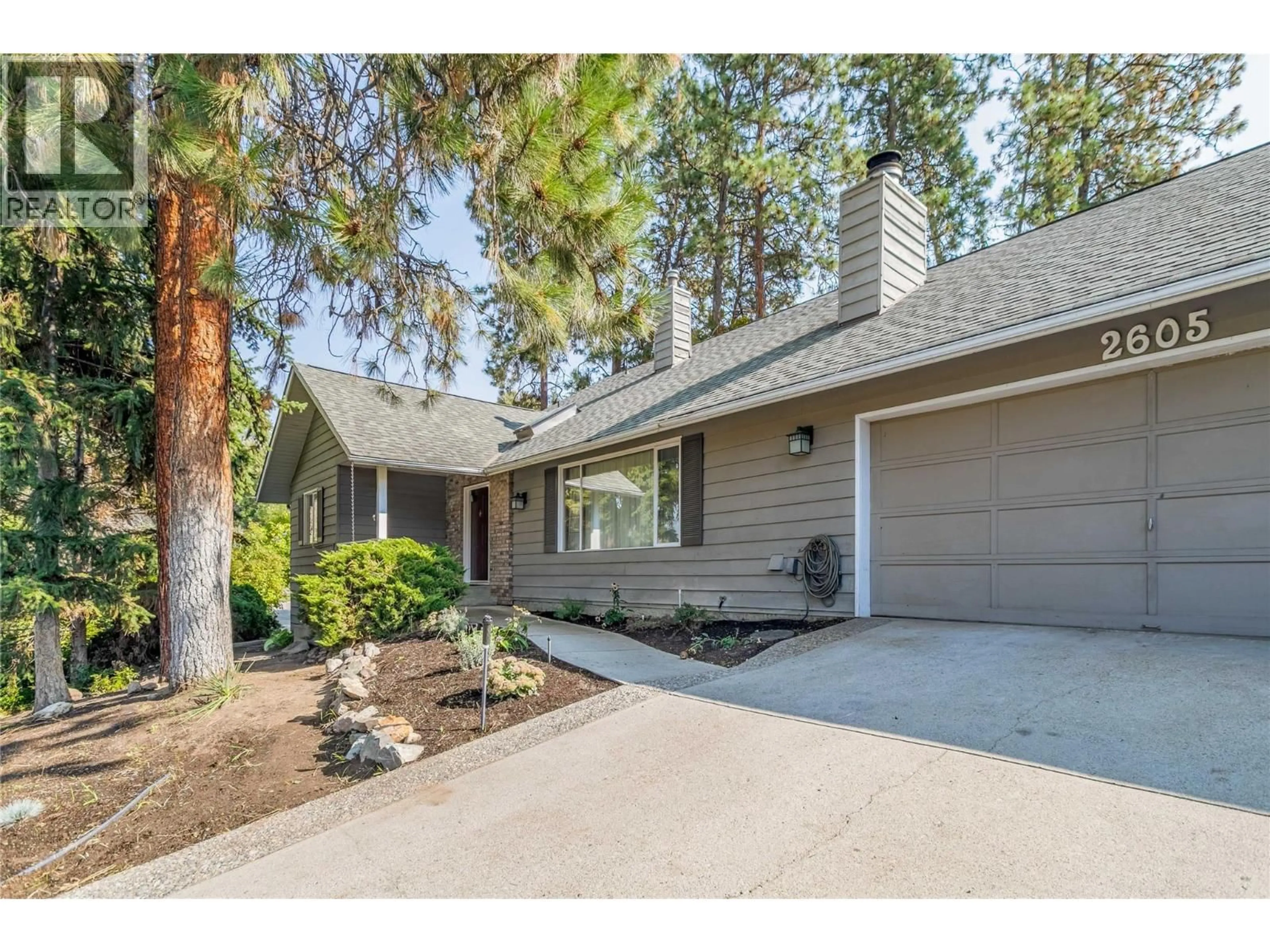 Home with vinyl exterior material, street for 2605 ALBERTA COURT, Kelowna British Columbia V1W2X8
