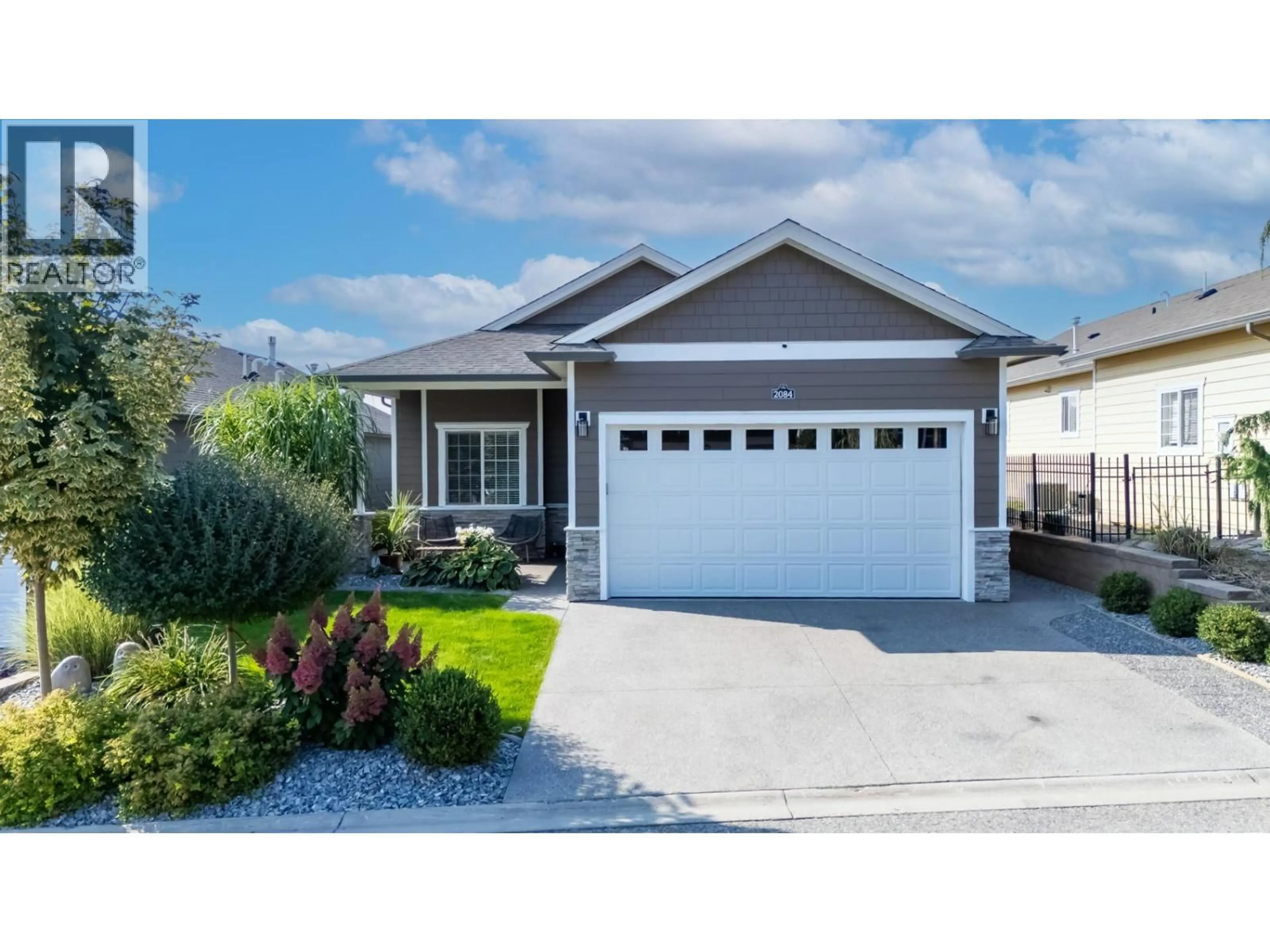 Home with vinyl exterior material, street for 2084 CLOVER DRIVE, West Kelowna British Columbia V4T3A5