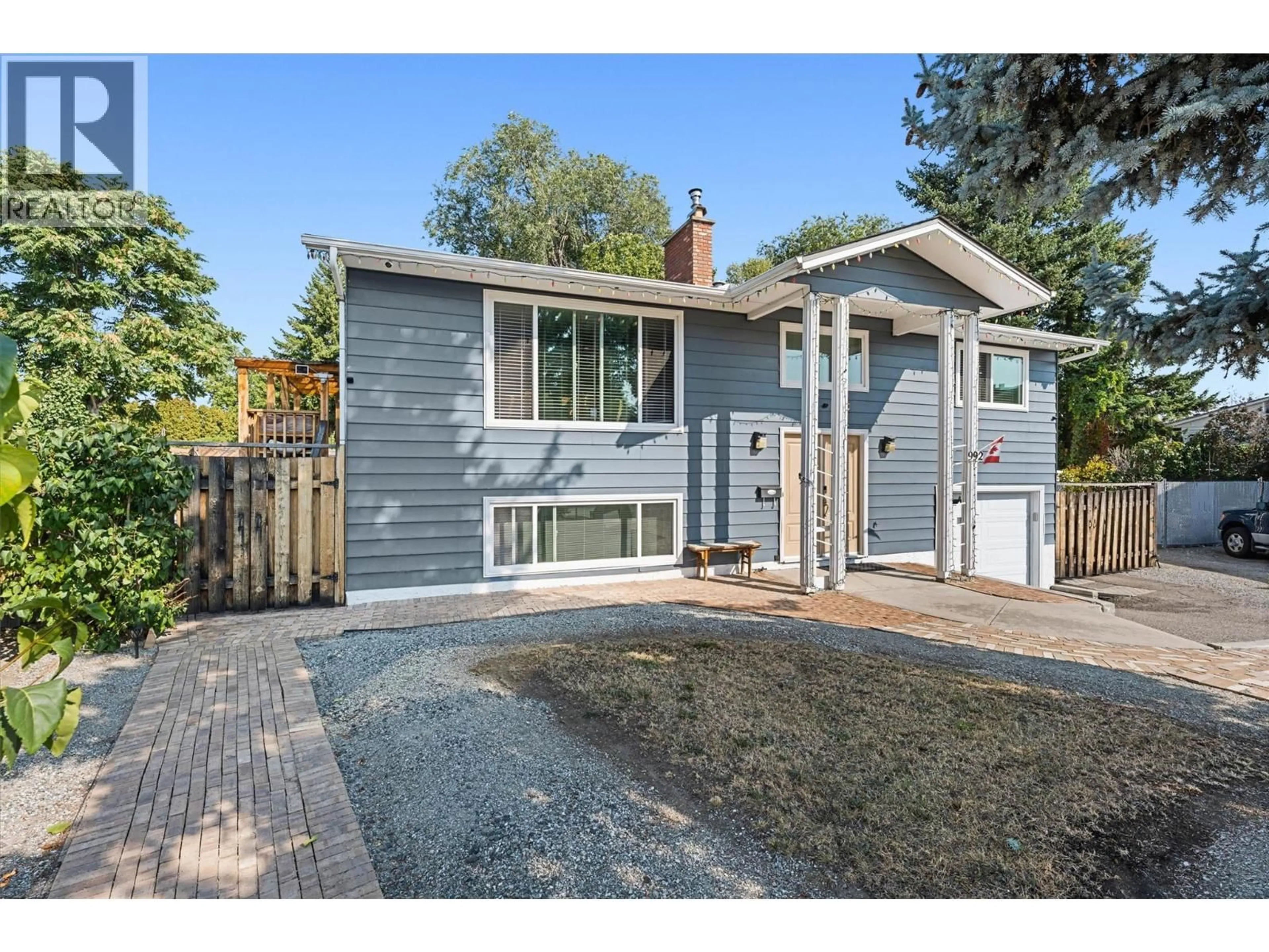 Home with brick exterior material, street for 992 GRENFELL COURT, Kelowna British Columbia V1Y8C5