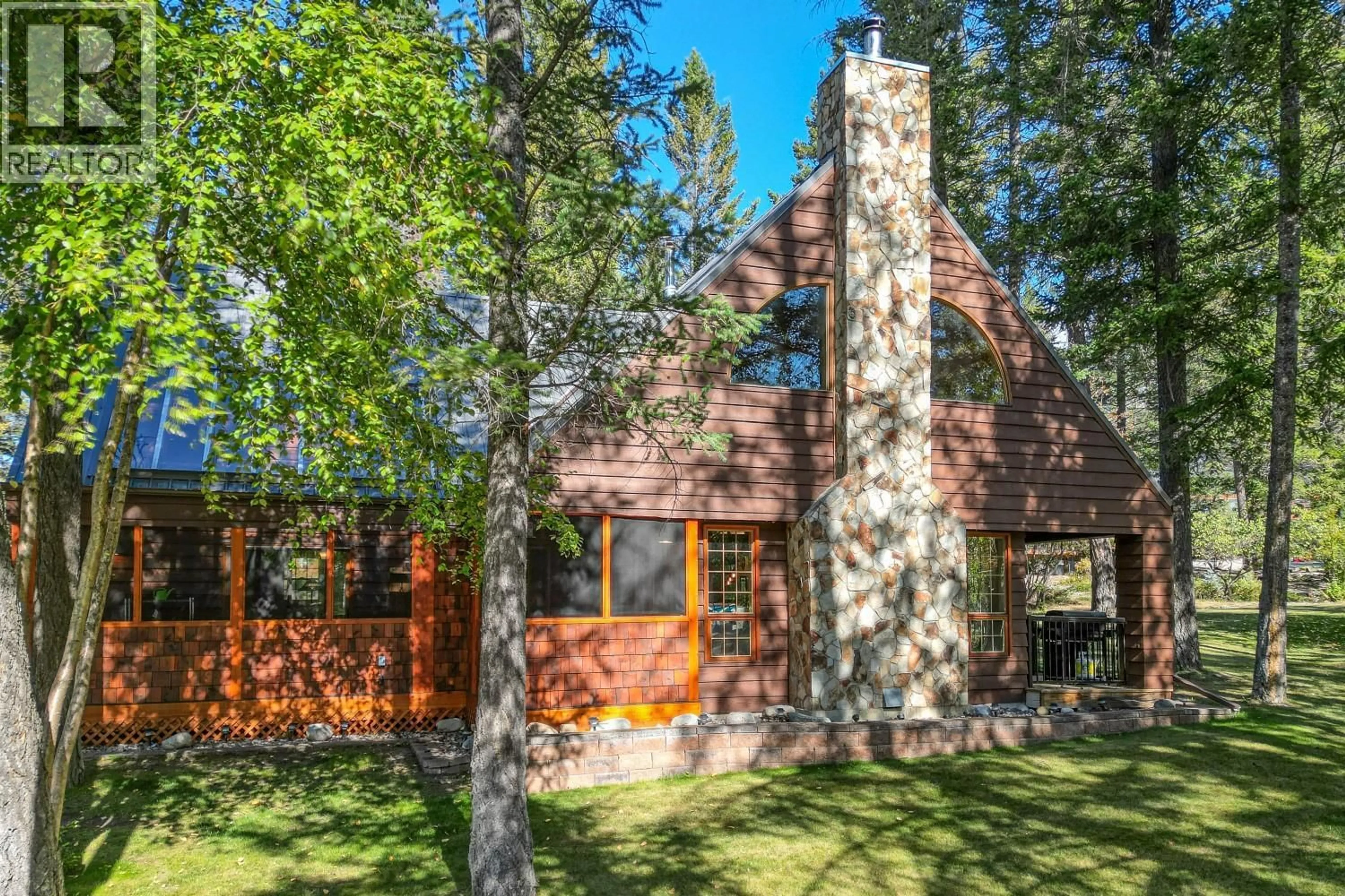 Home with brick exterior material, forest/trees view for 4891 FAIRMONT CREEK ROAD, Fairmont Hot Springs British Columbia V0B1L1