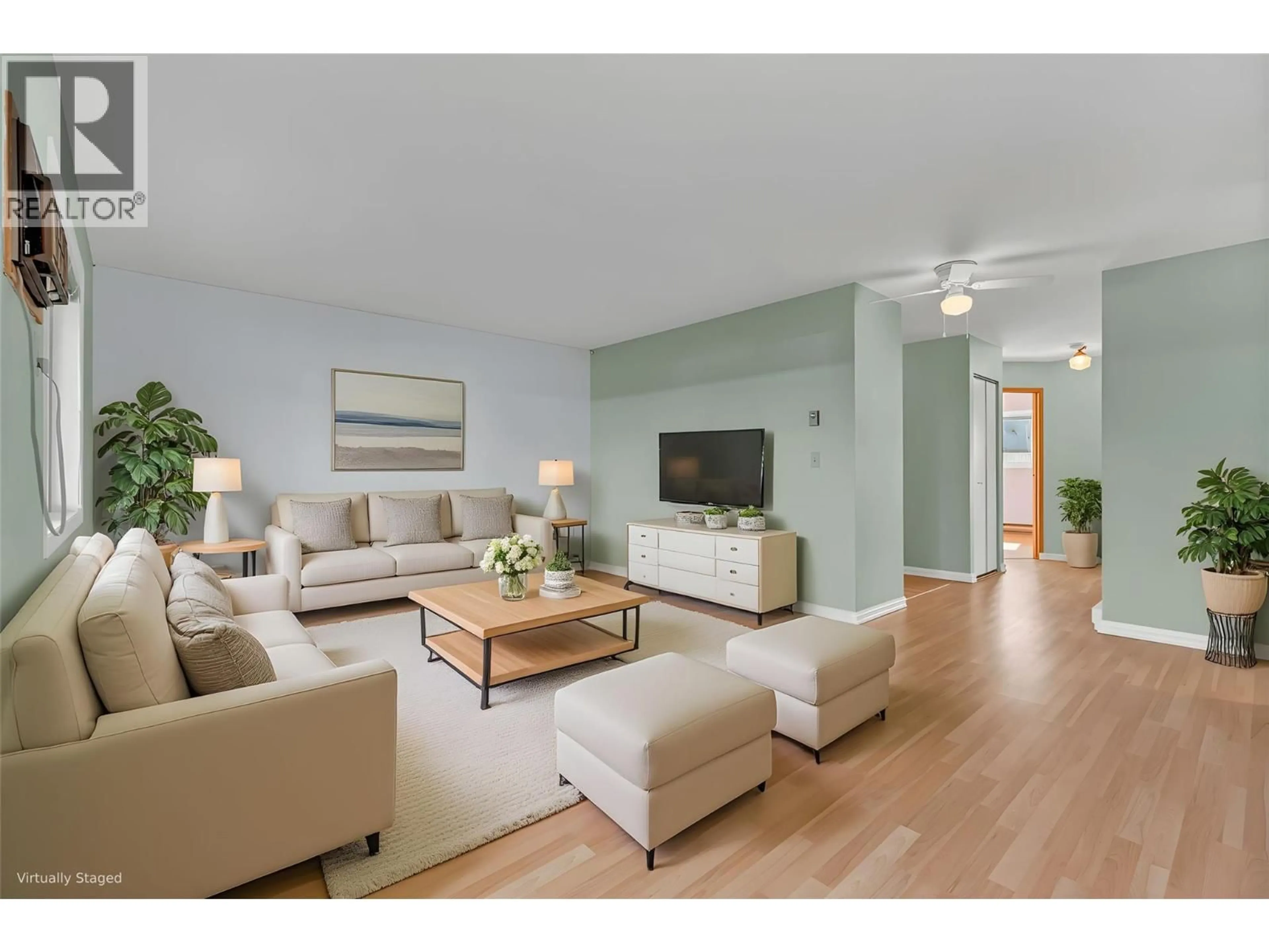 Living room with furniture, wood/laminate floor for 106 - 1860 ATKINSON STREET STREET, Penticton British Columbia V2A7M6
