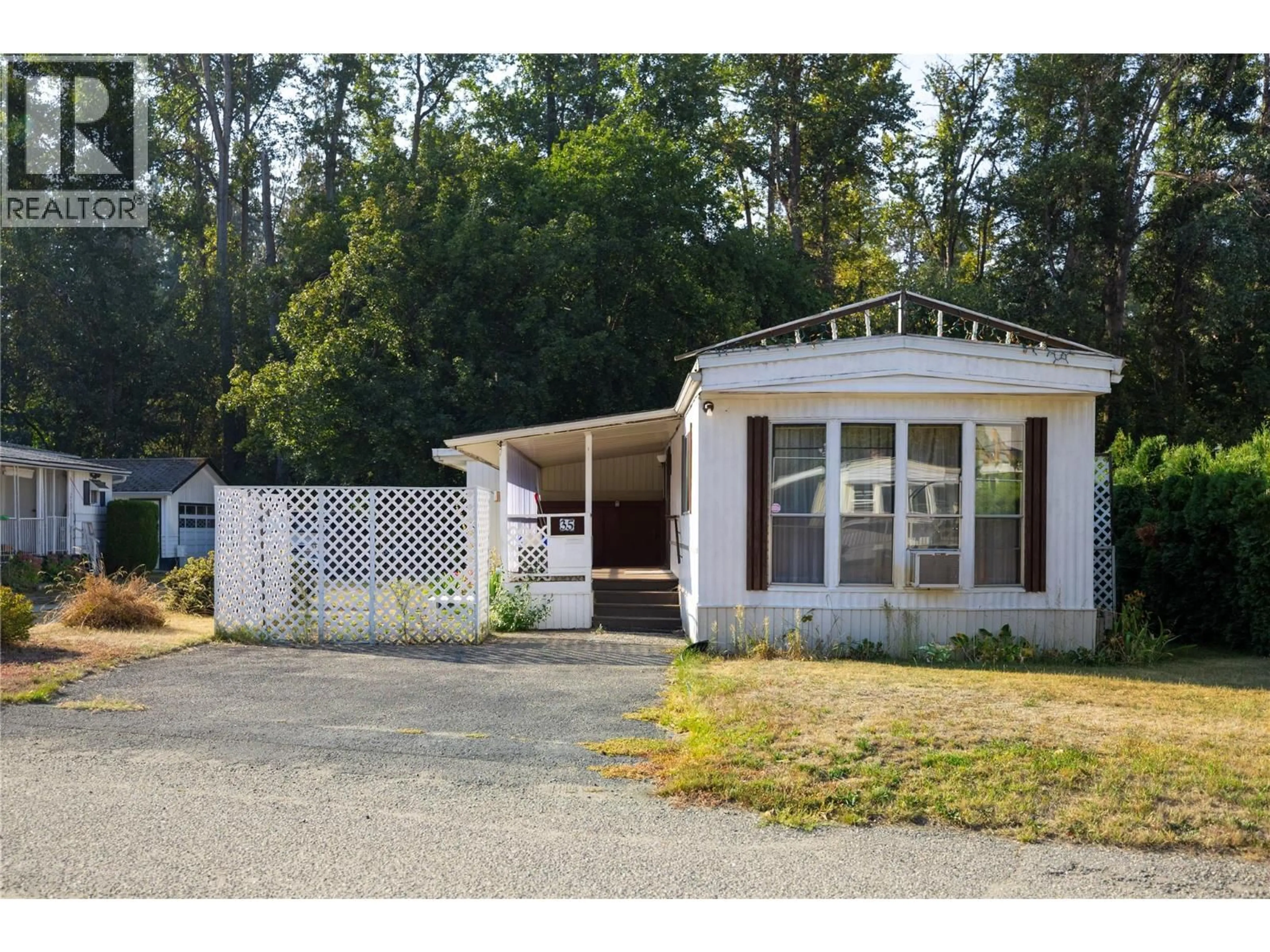 Home with vinyl exterior material, street for 35 - 4701 PLEASANT VALLEY ROAD, Vernon British Columbia V1T4M7