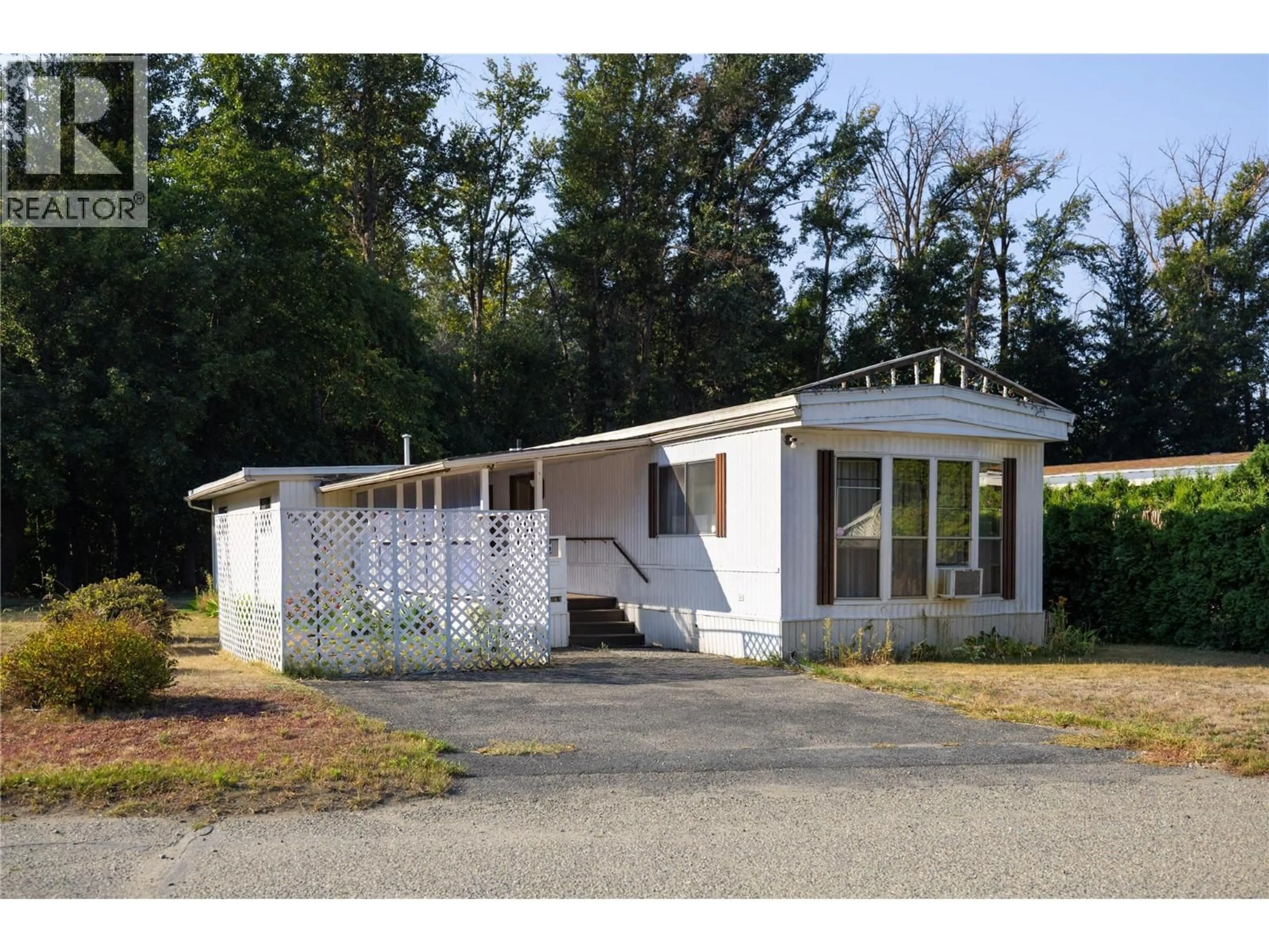 Home with vinyl exterior material, street for 35 - 4701 PLEASANT VALLEY ROAD, Vernon British Columbia V1T4M7