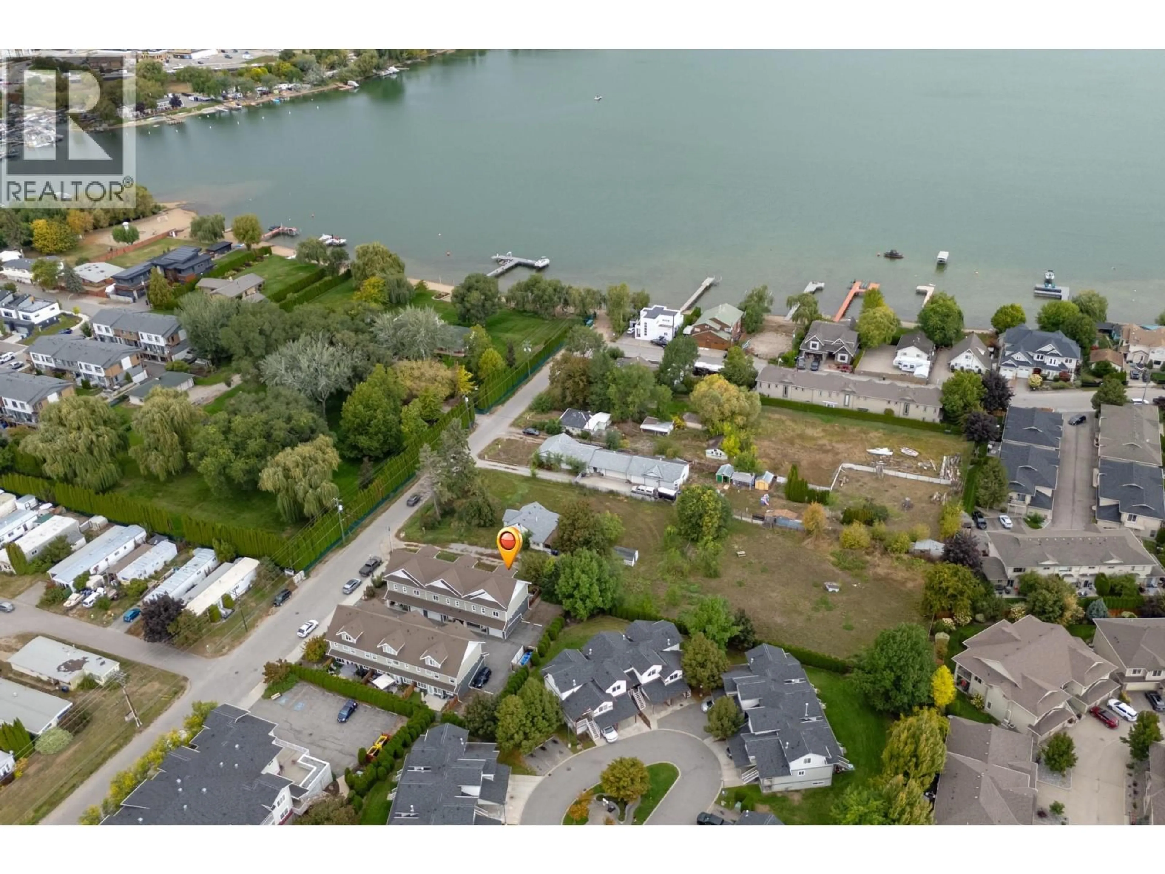 A pic from outside/outdoor area/front of a property/back of a property/a pic from drone, water/lake/river/ocean view for 3 - 11511 BOTTOM WOOD LAKE ROAD, Lake Country British Columbia V4V1X7