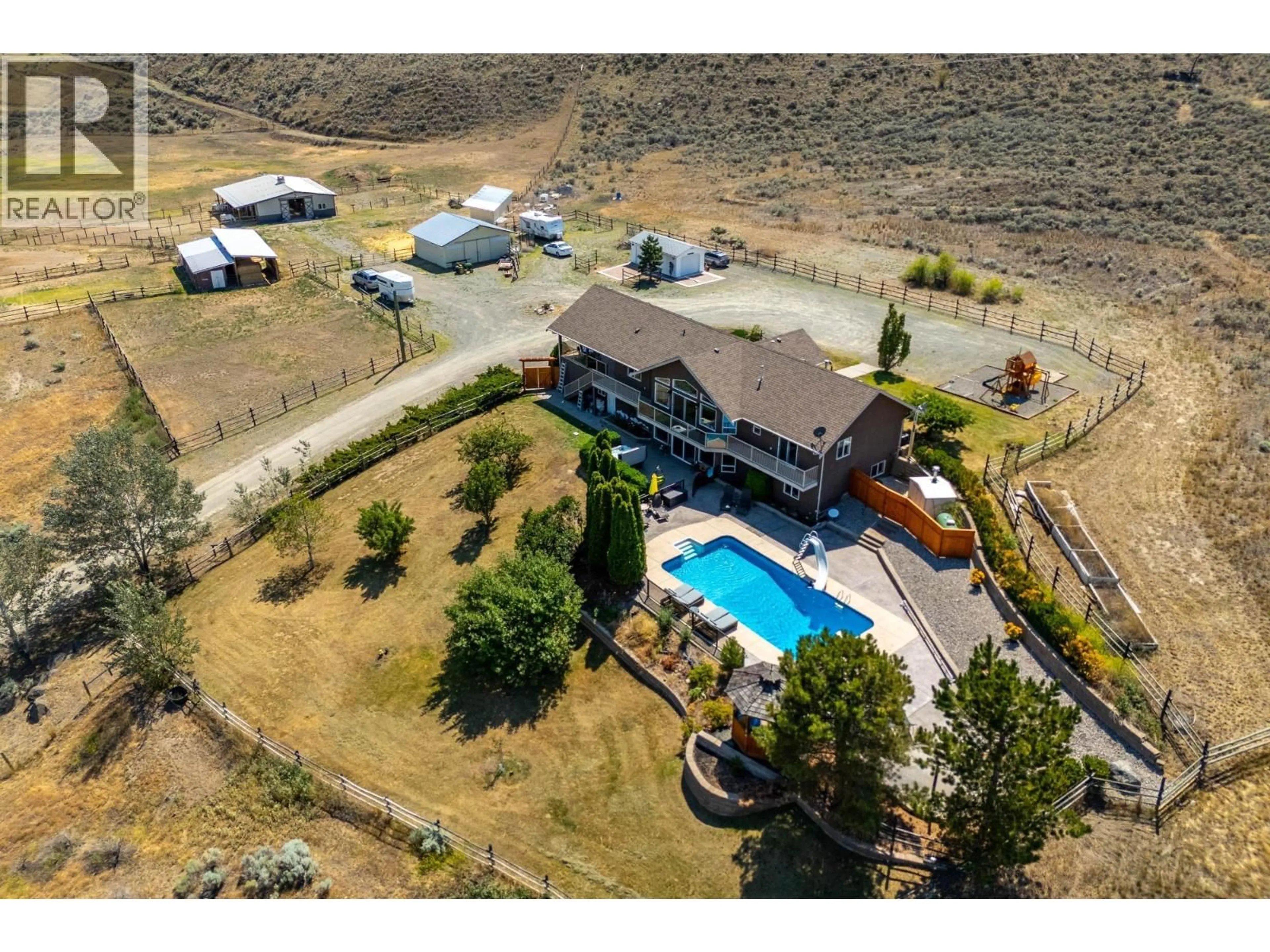 A pic from outside/outdoor area/front of a property/back of a property/a pic from drone, mountain view for 5852 RODEO DRIVE, Kamloops British Columbia V2C6C3