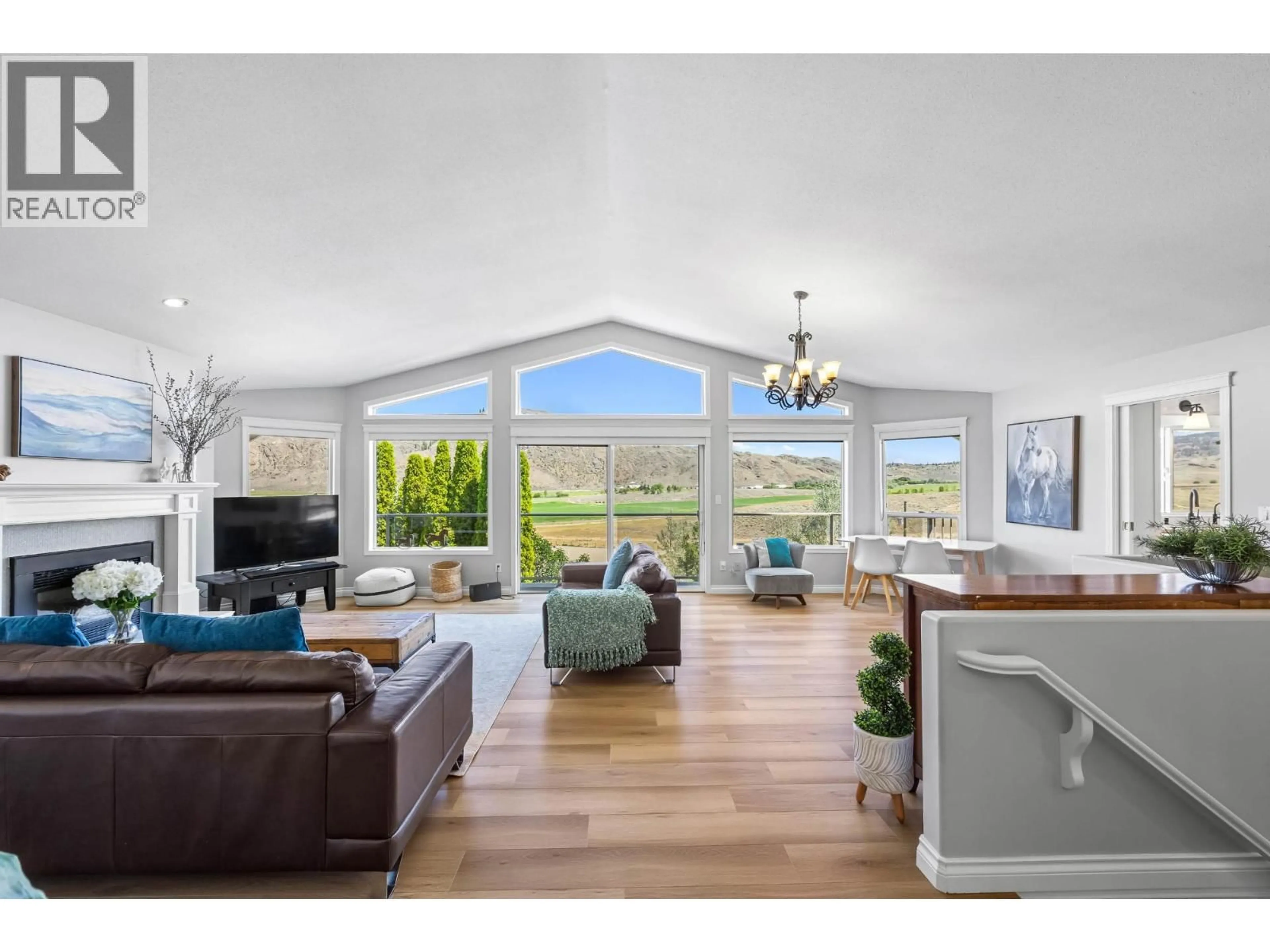 Living room with furniture, wood/laminate floor for 5852 RODEO DRIVE, Kamloops British Columbia V2C6C3