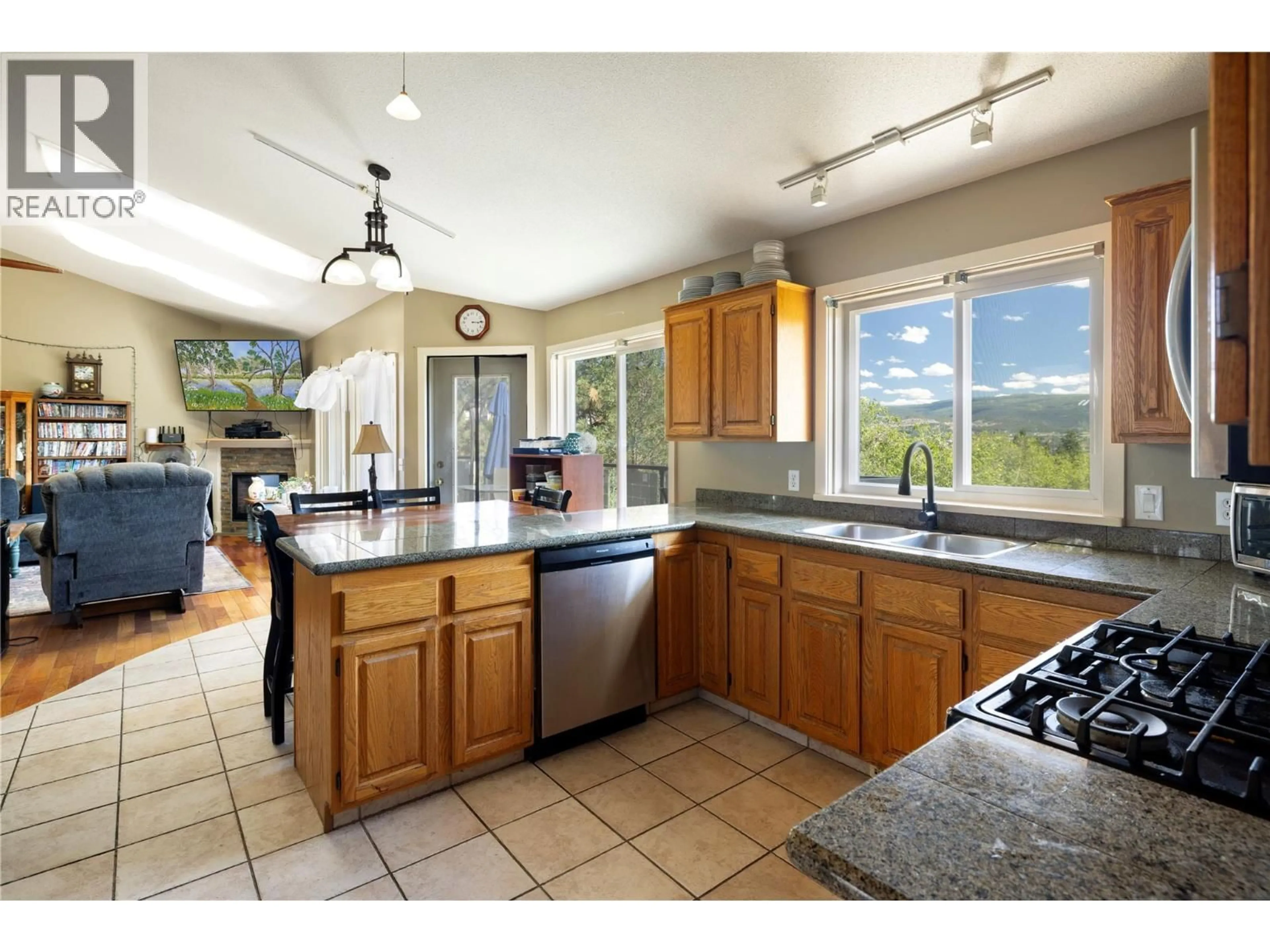 Open concept kitchen, ceramic/tile floor for 2391 NAHANNI COURT, Kelowna British Columbia V1V1N1