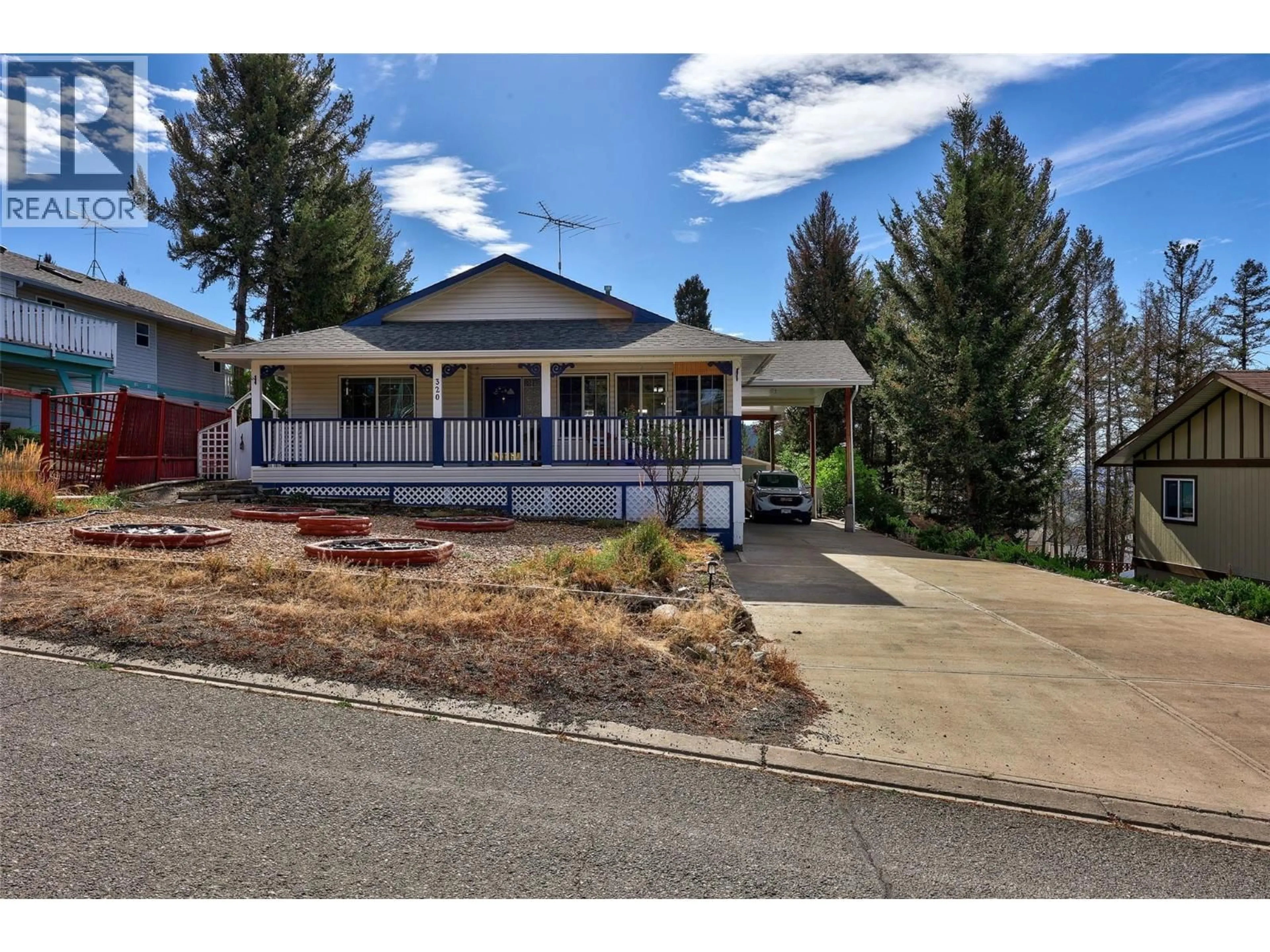 Home with vinyl exterior material, street for 320 LINDEN ROAD, Logan Lake British Columbia V0K1W0