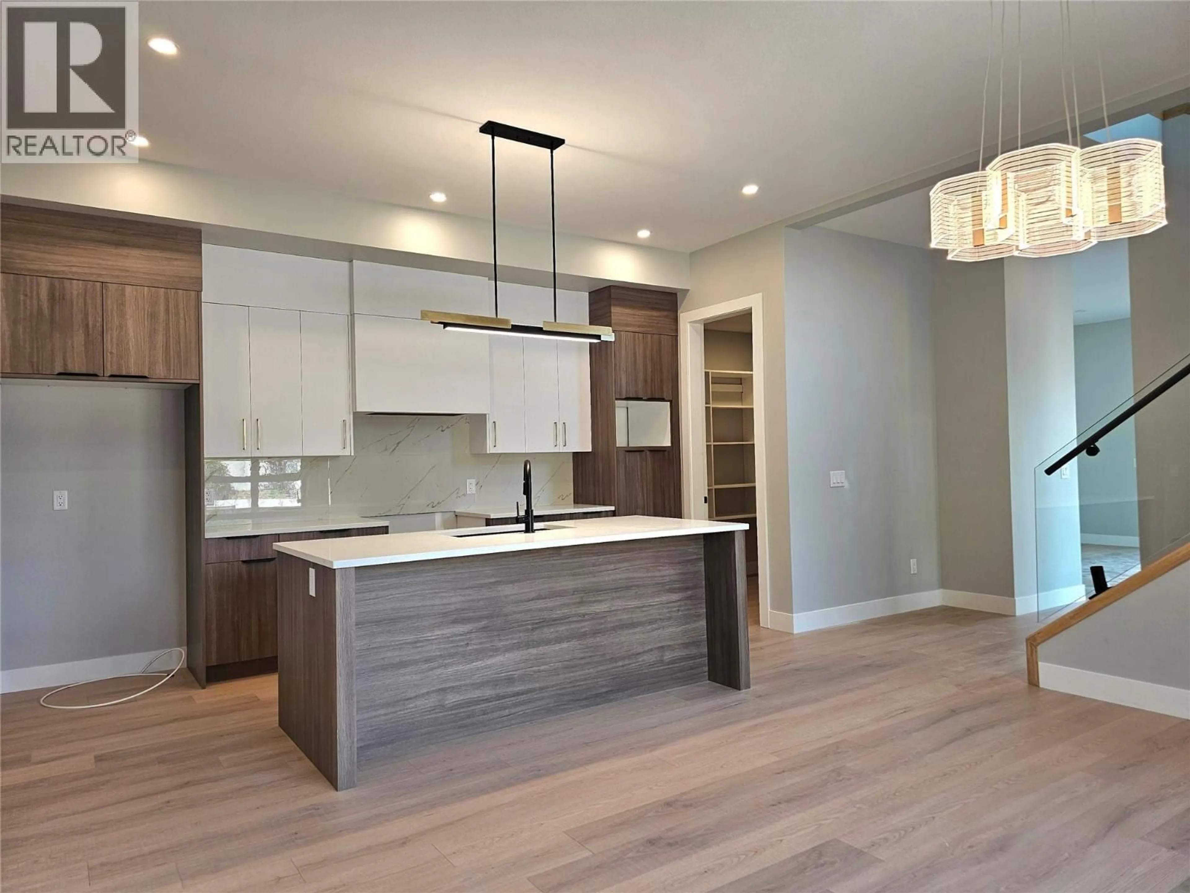 Open concept kitchen, wood/laminate floor for 3 - 757 BARNABY ROAD, Kelowna British Columbia V1W4N9