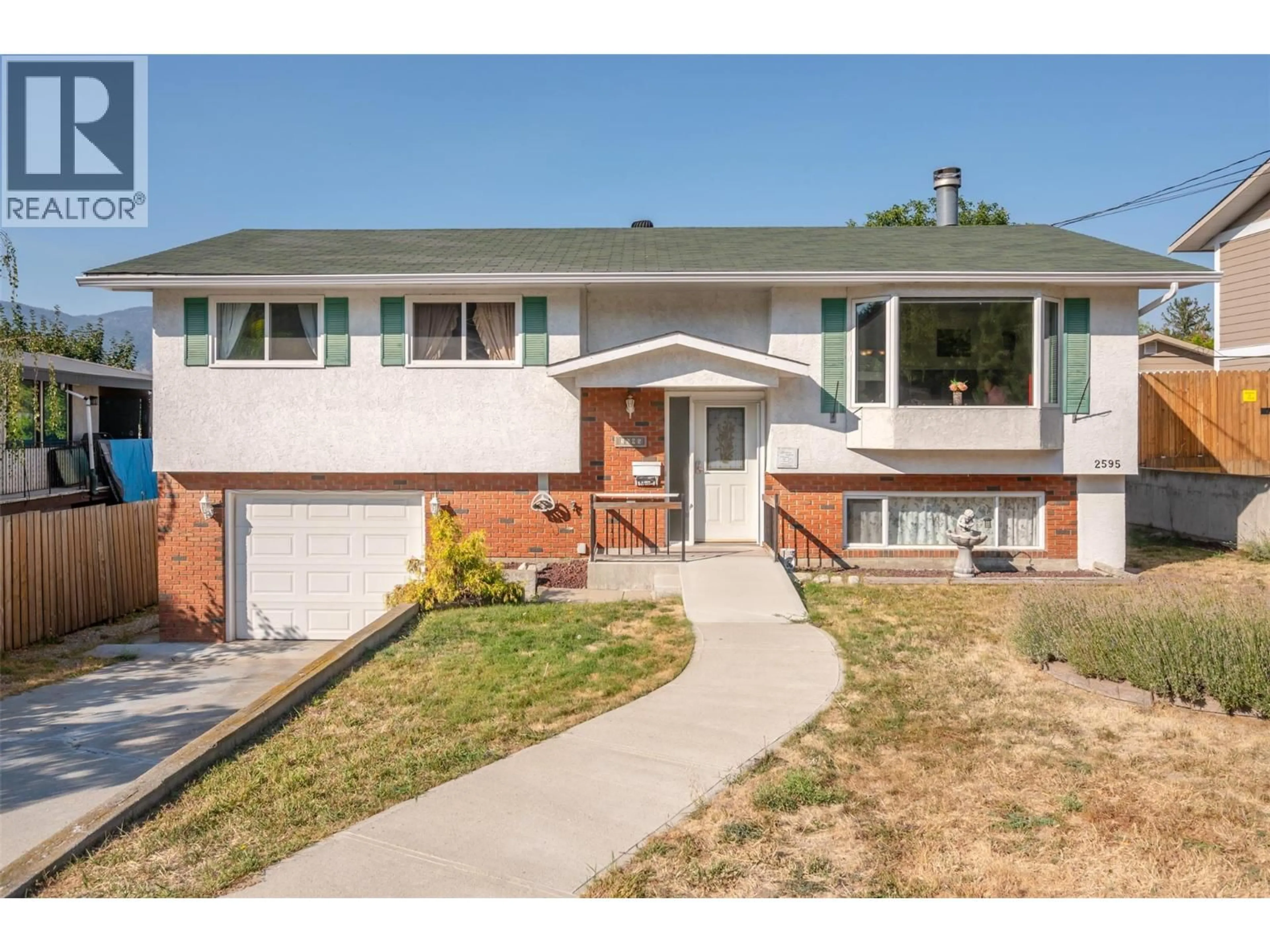Home with vinyl exterior material, street for 2595 DARTMOUTH DRIVE, Penticton British Columbia V2A7T5
