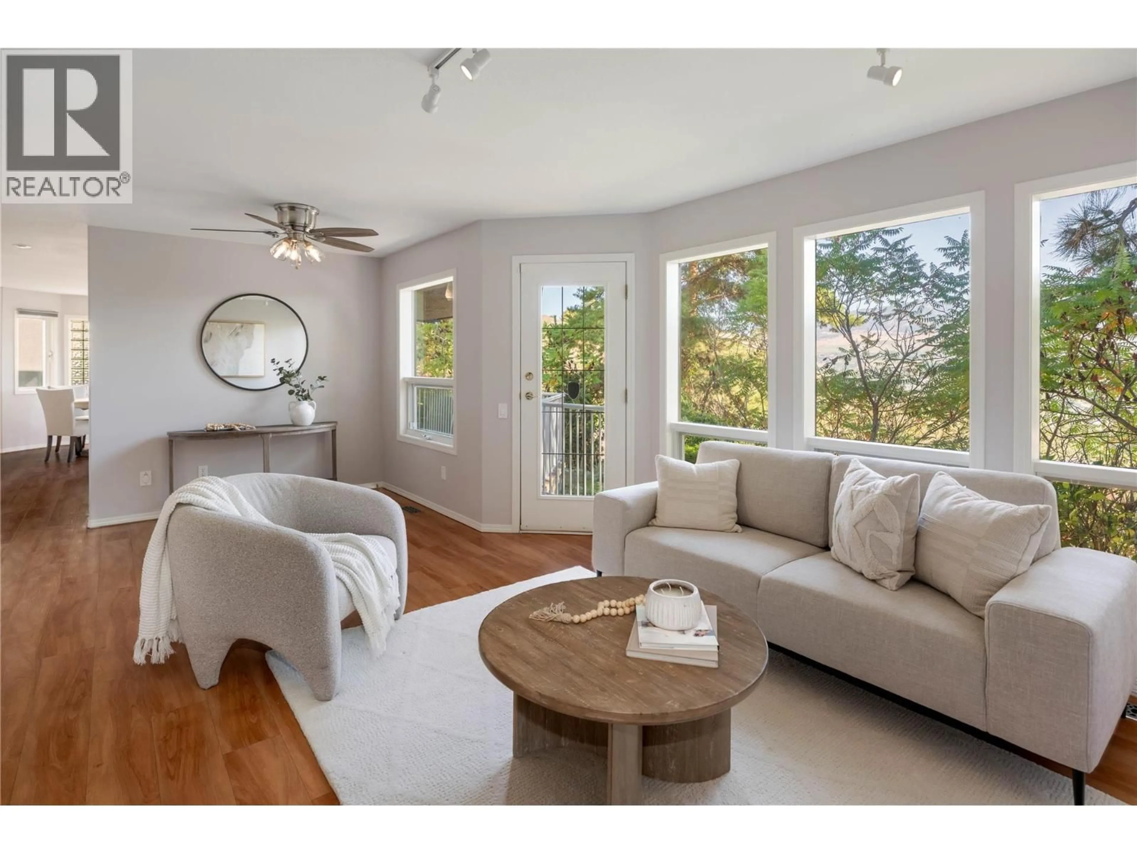 Living room with furniture, wood/laminate floor for 16 - 980 DILWORTH DRIVE, Kelowna British Columbia V1V1S6