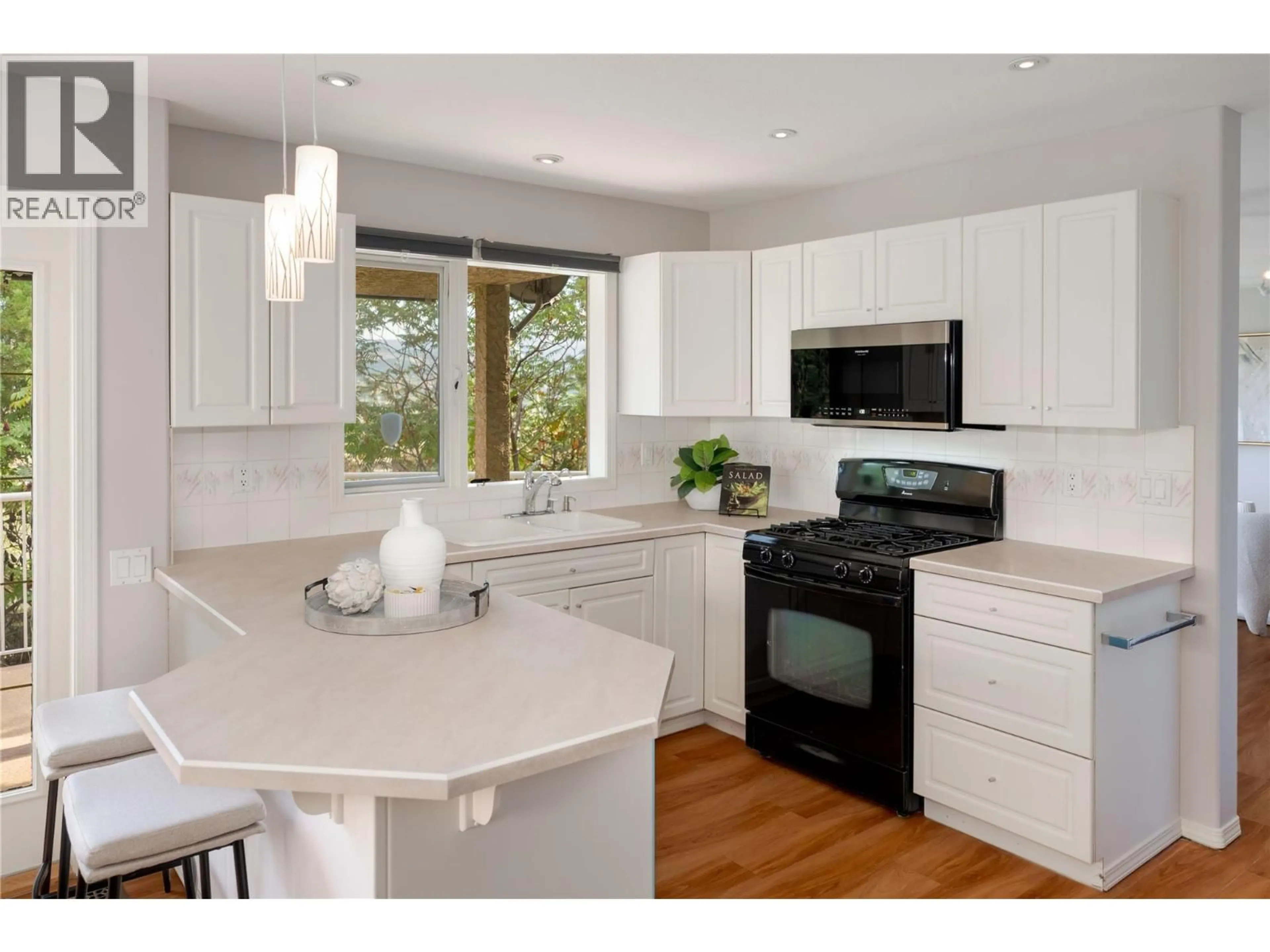 Open concept kitchen, wood/laminate floor for 16 - 980 DILWORTH DRIVE, Kelowna British Columbia V1V1S6
