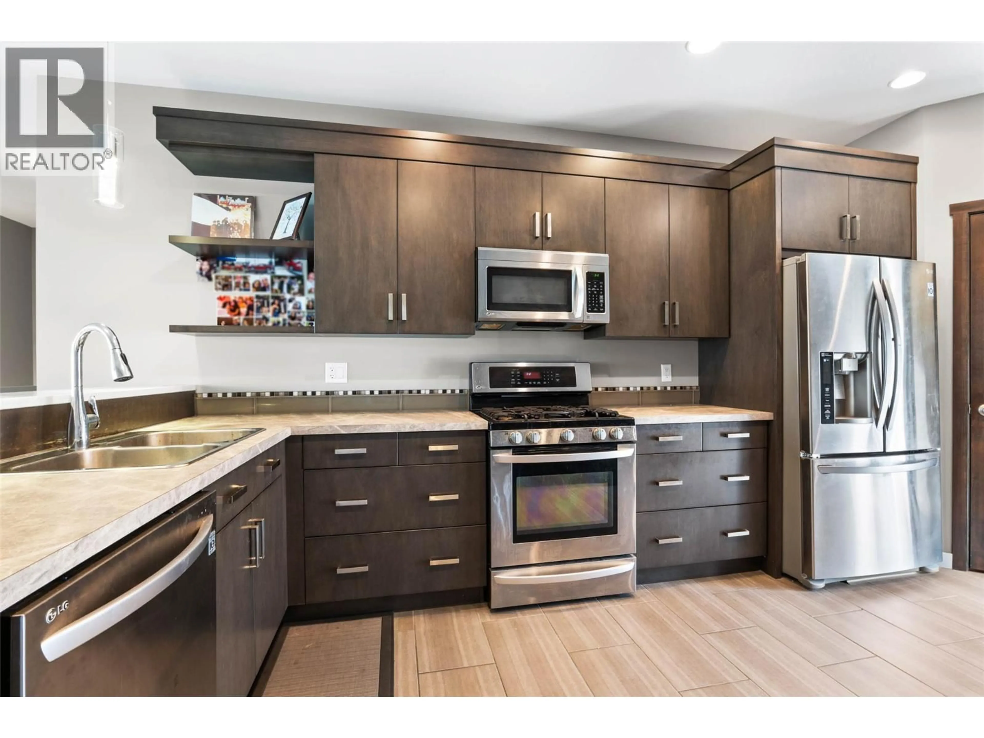 Open concept kitchen, wood/laminate floor for 2209 SADDLEBACK DRIVE, Kamloops British Columbia V2B0G7