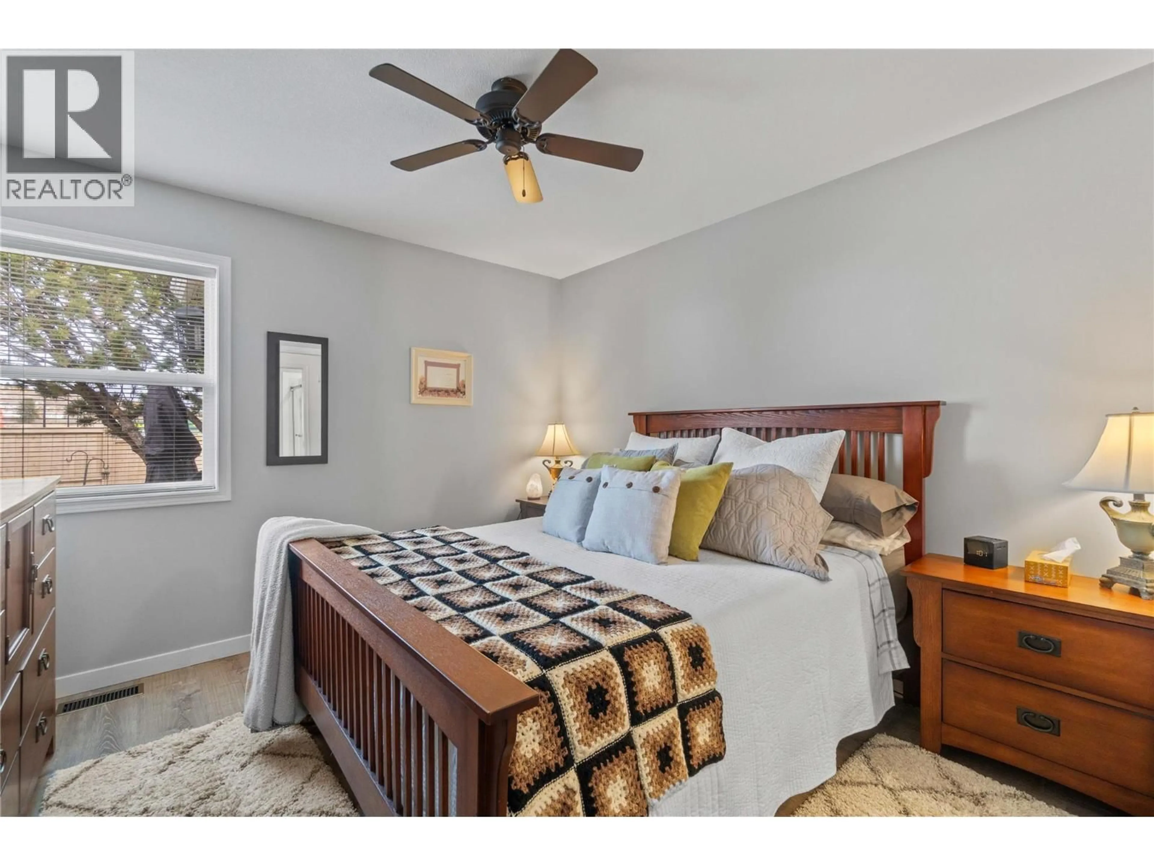 Bedroom with bed, wood/laminate floor for 14 - 2210 LOUIE DRIVE, West Kelowna British Columbia V4T2L7