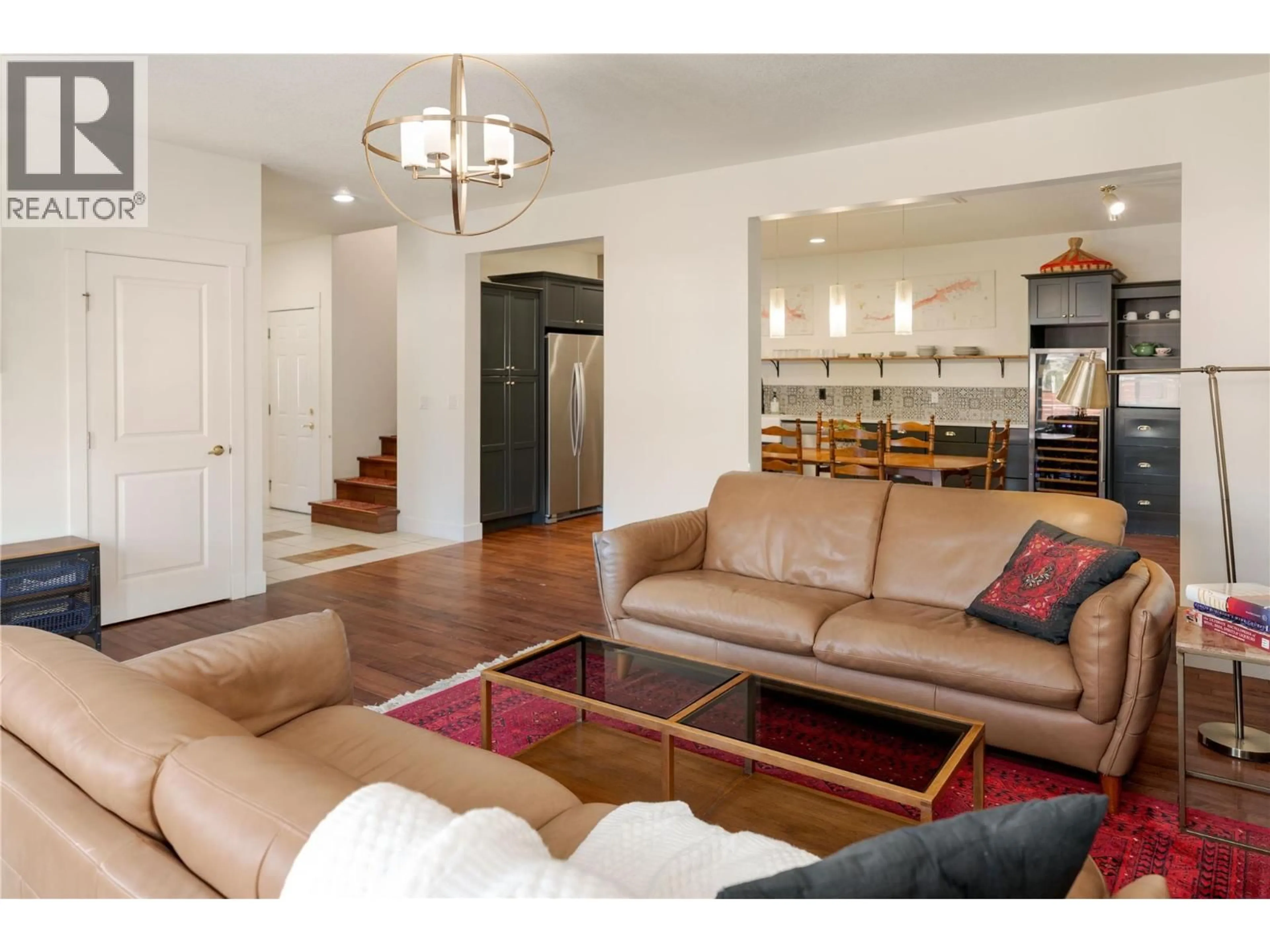 Living room with furniture, wood/laminate floor for 1818 BOWES STREET, Kelowna British Columbia V1Y0B3
