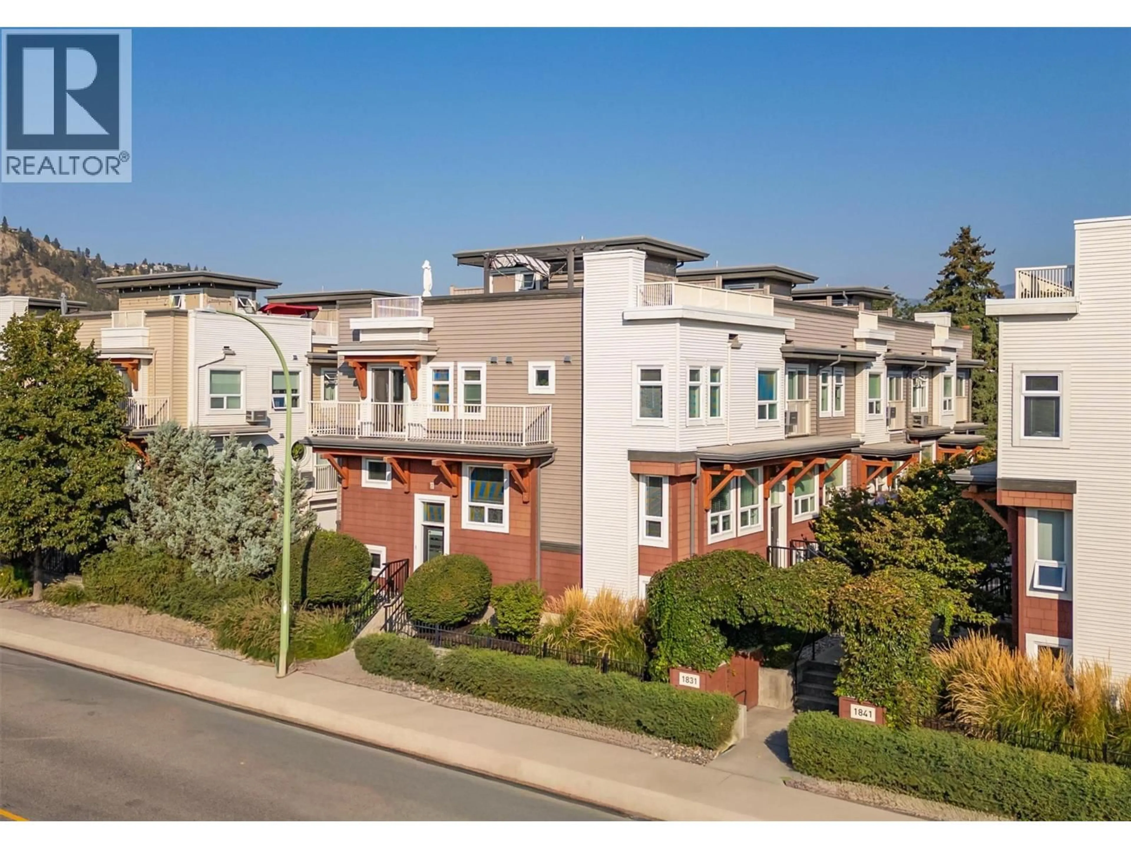 A pic from outside/outdoor area/front of a property/back of a property/a pic from drone, street for 1 - 1831 AMBROSI ROAD, Kelowna British Columbia V1Y4S1