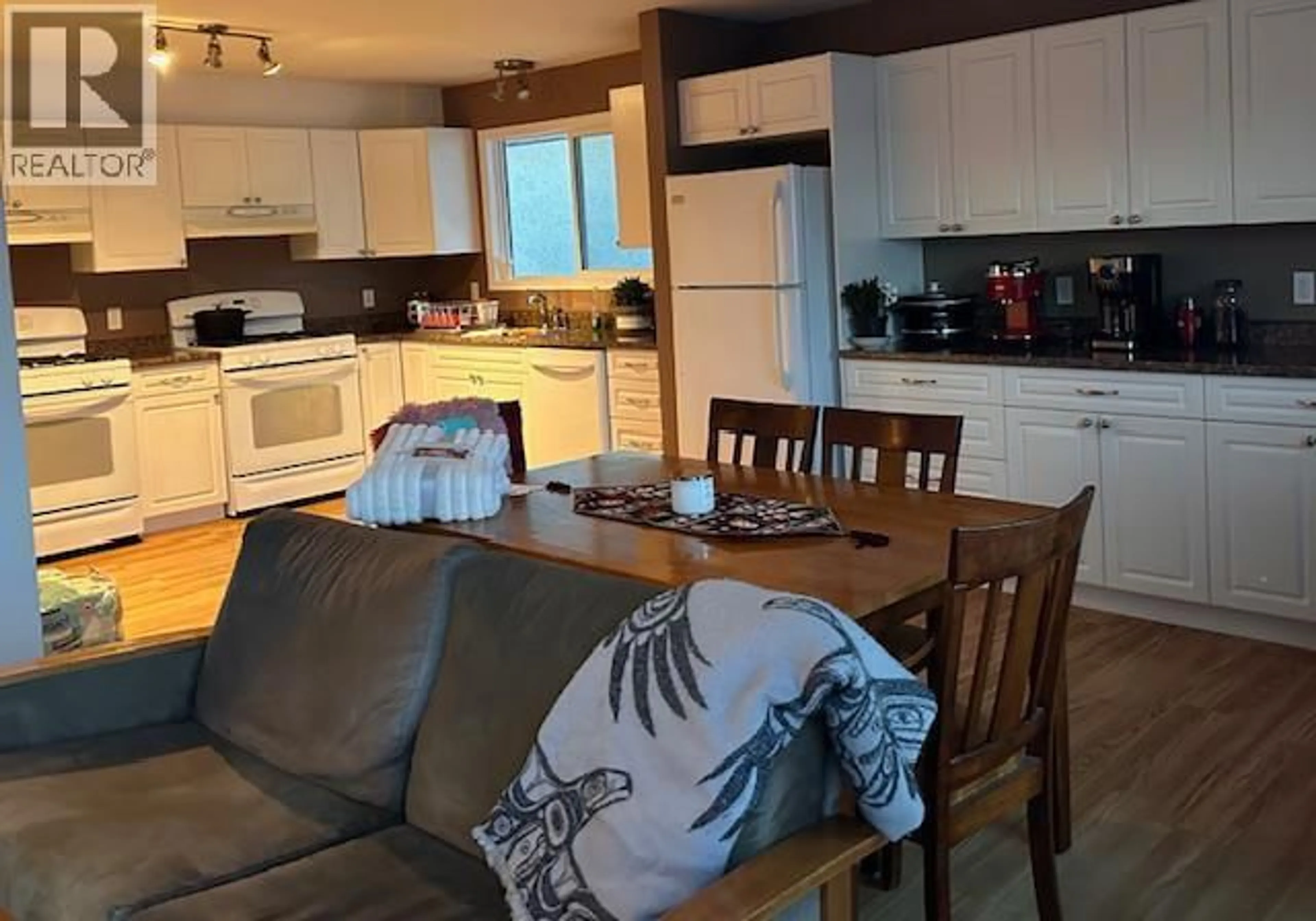 Open concept kitchen, wood/laminate floor for 5113 47 AVENUE NORTHWEST, Chetwynd British Columbia V0C1J0