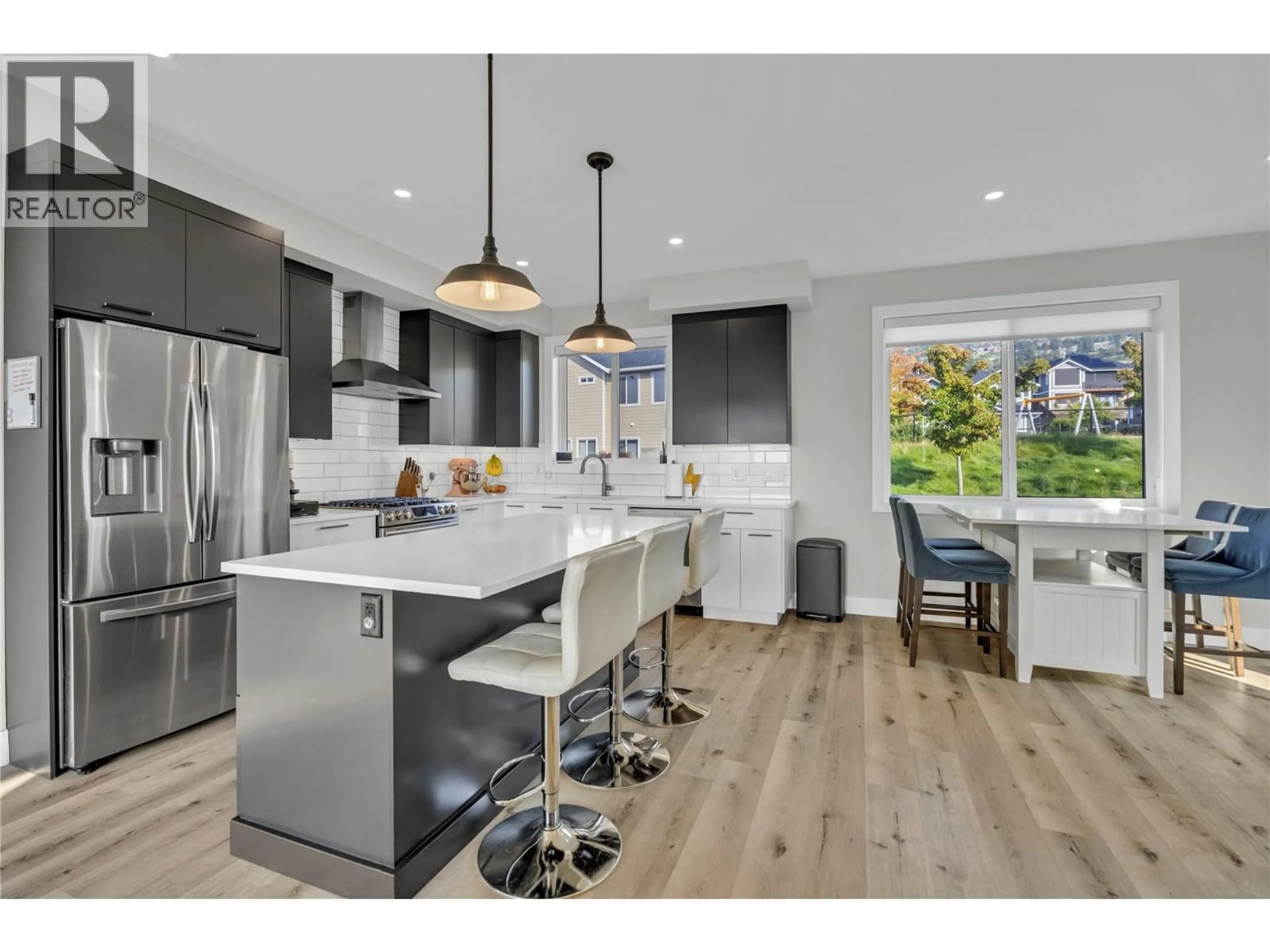Open concept kitchen, wood/laminate floor for 101 - 1001 ANTLER DRIVE, Penticton British Columbia V2A0C8