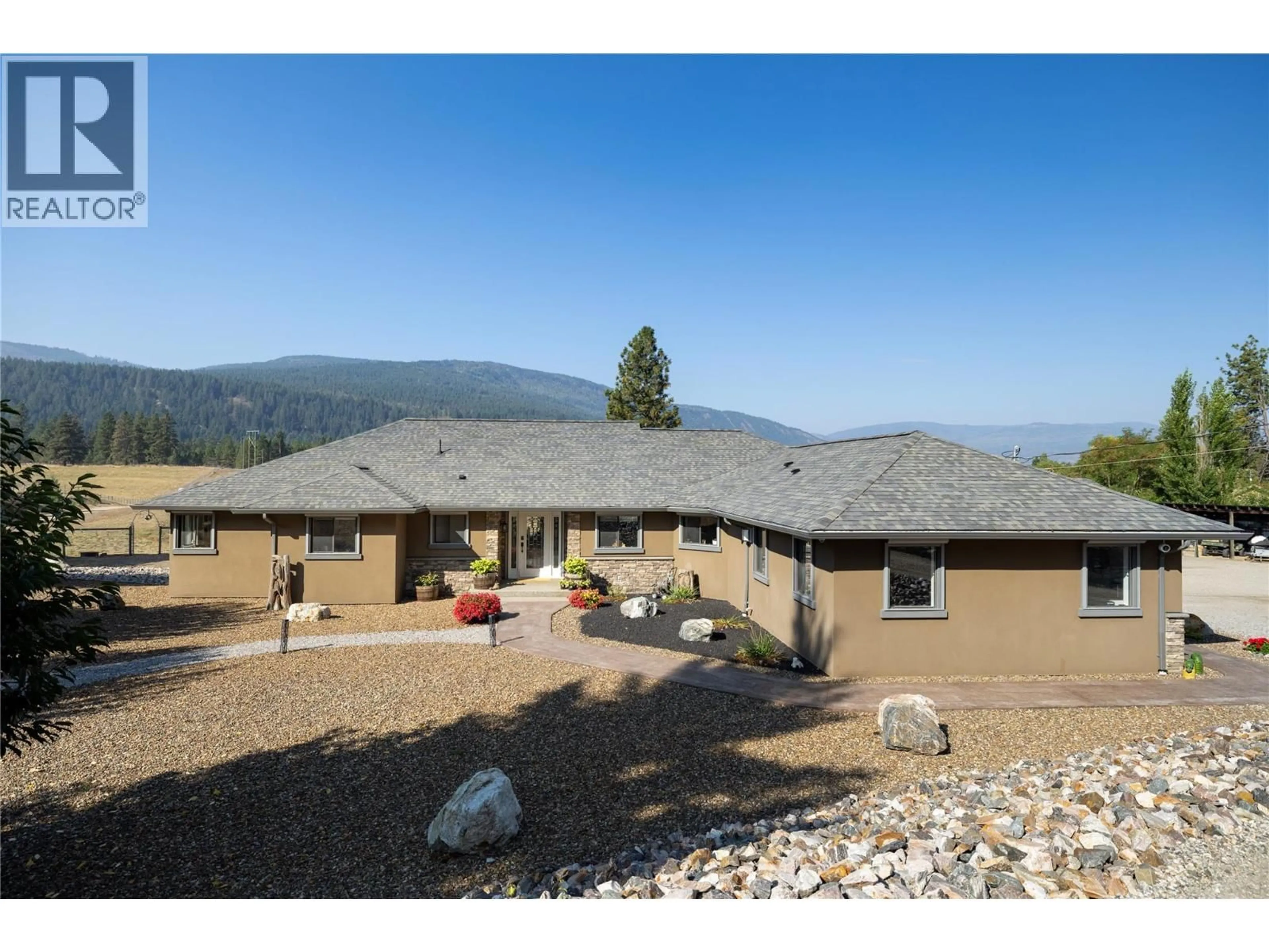 A pic from outside/outdoor area/front of a property/back of a property/a pic from drone, mountain view for 1258 ROUND LAKE ROAD, Spallumcheen British Columbia V0E1B5