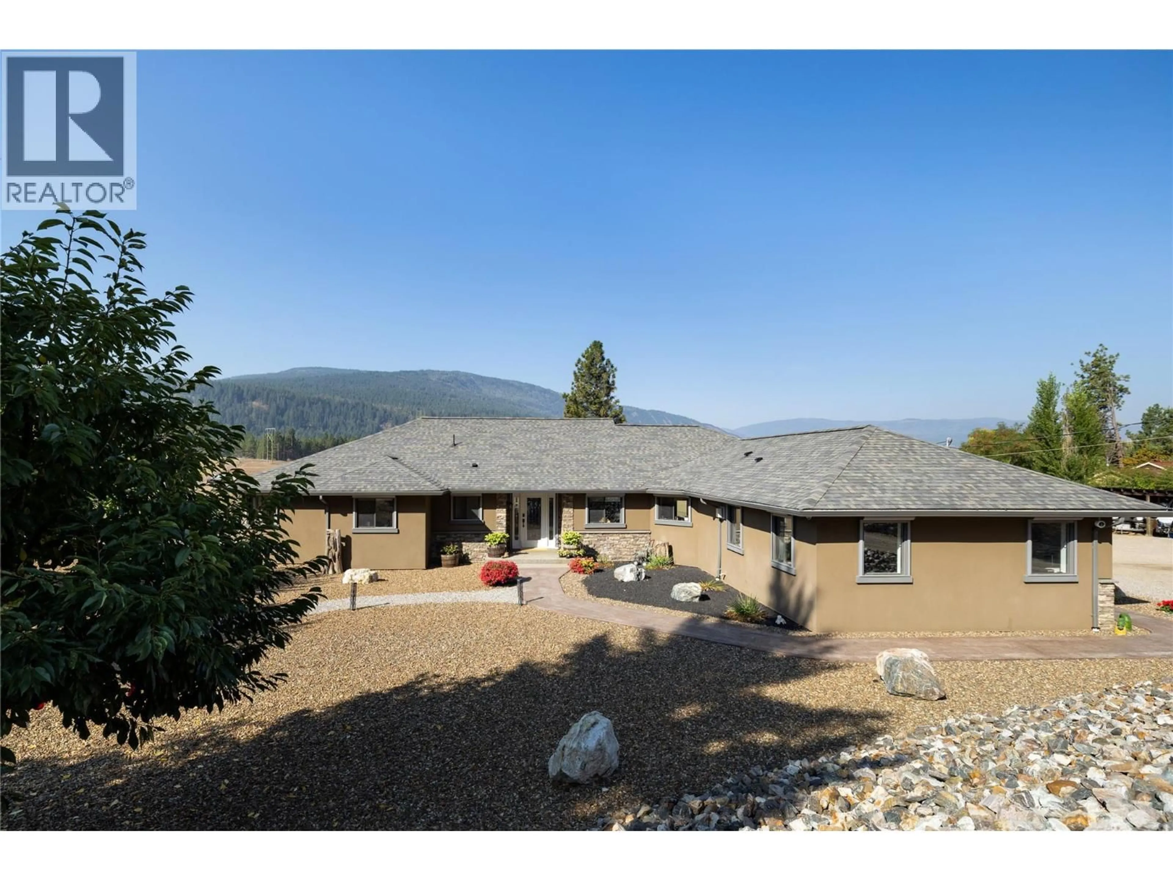 A pic from outside/outdoor area/front of a property/back of a property/a pic from drone, mountain view for 1258 ROUND LAKE ROAD, Spallumcheen British Columbia V0E1B5