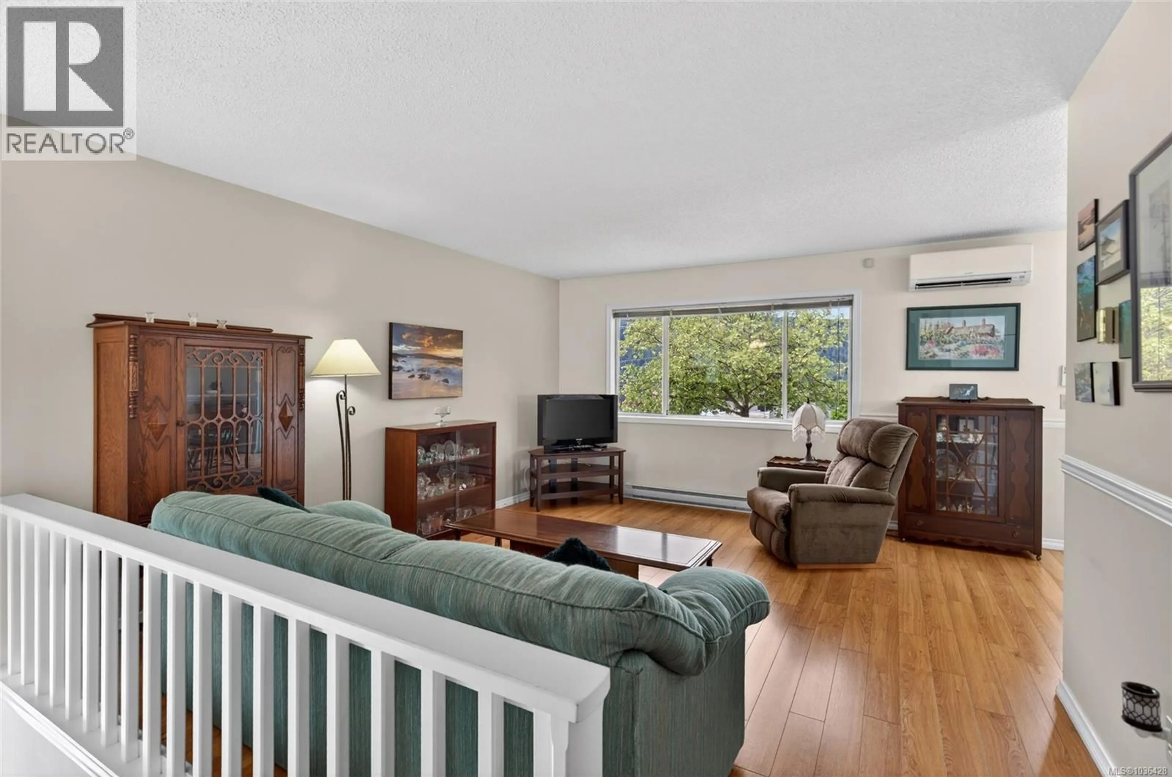 Living room with furniture, wood/laminate floor for 2561 3RD AVENUE, Port Alberni British Columbia V9Y8S6