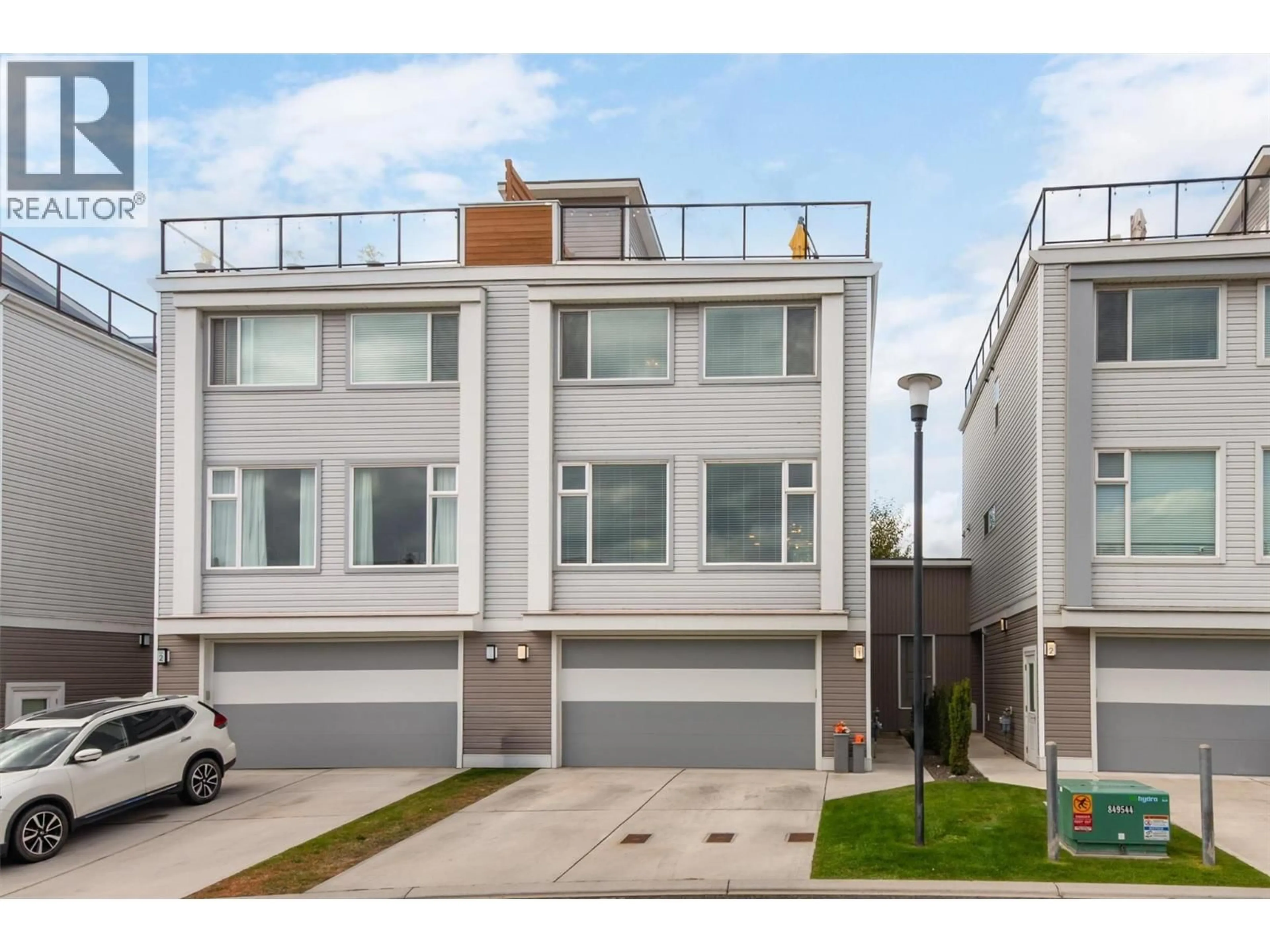 Home with vinyl exterior material, street for 1 - 2051 ELKRIDGE DRIVE, West Kelowna British Columbia V4T3K1