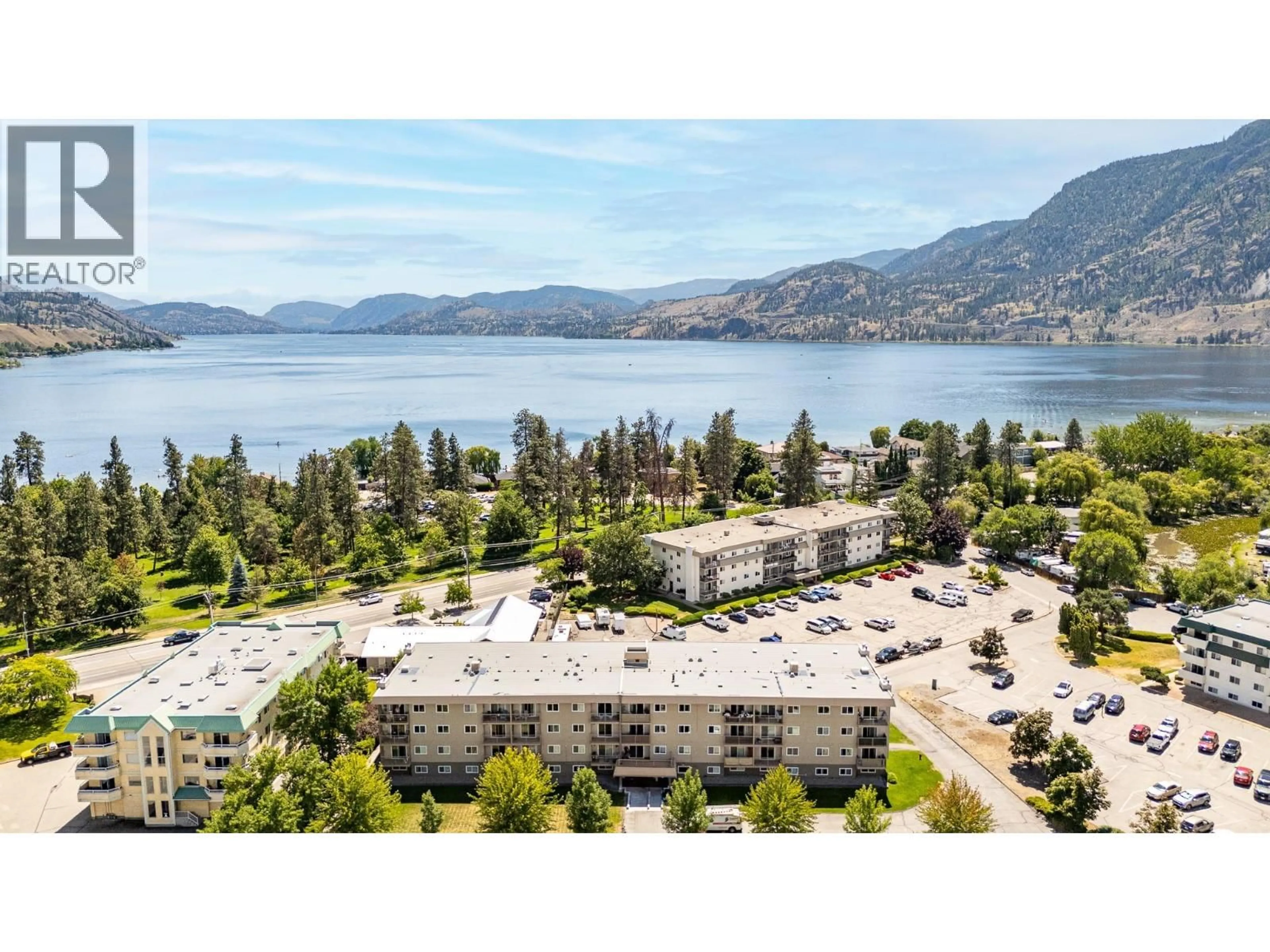 A pic from outside/outdoor area/front of a property/back of a property/a pic from drone, water/lake/river/ocean view for 306 - 130 SKAHA PLACE, Penticton British Columbia V2A7J6
