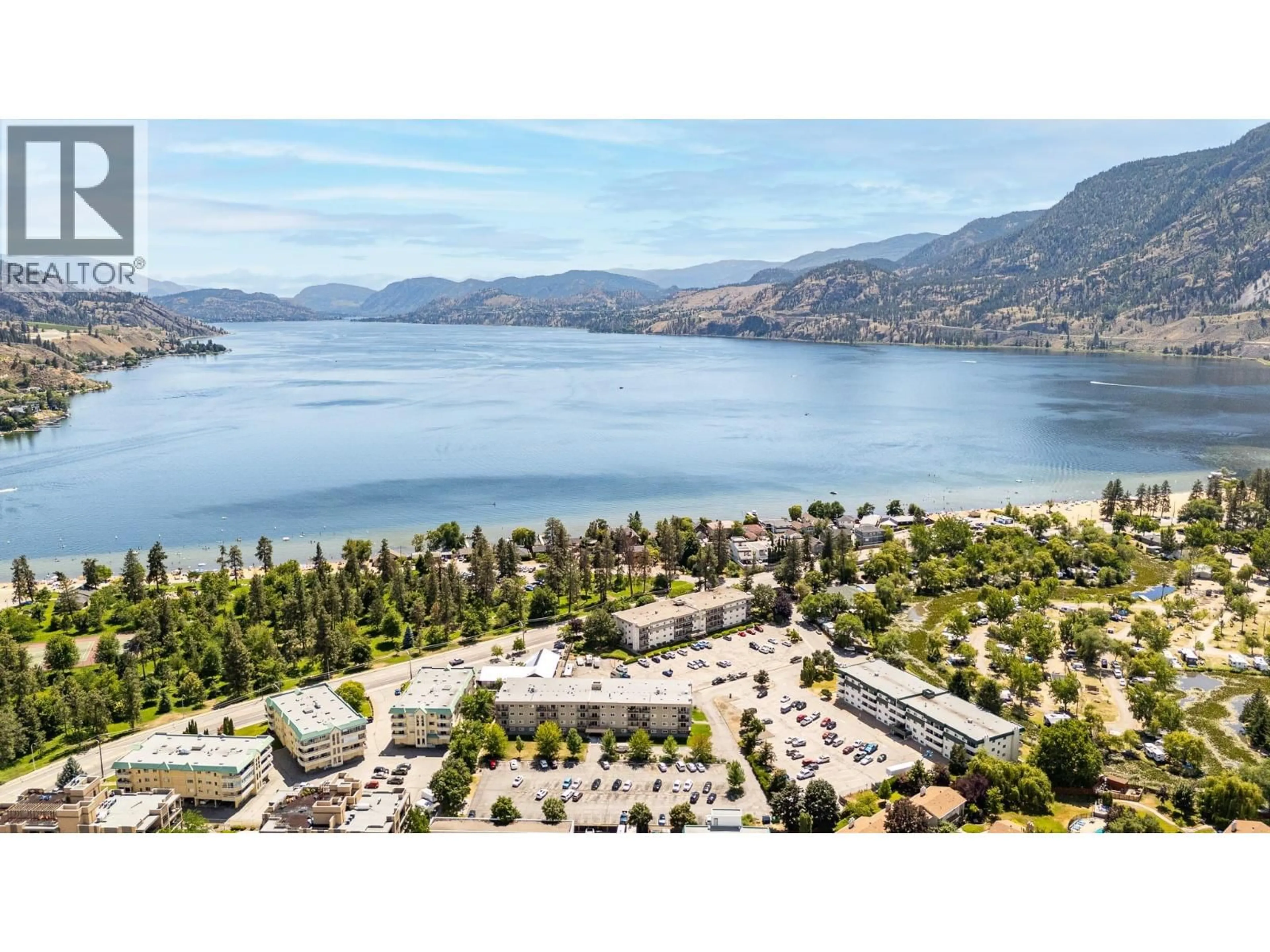 A pic from outside/outdoor area/front of a property/back of a property/a pic from drone, water/lake/river/ocean view for 306 - 130 SKAHA PLACE, Penticton British Columbia V2A7J6