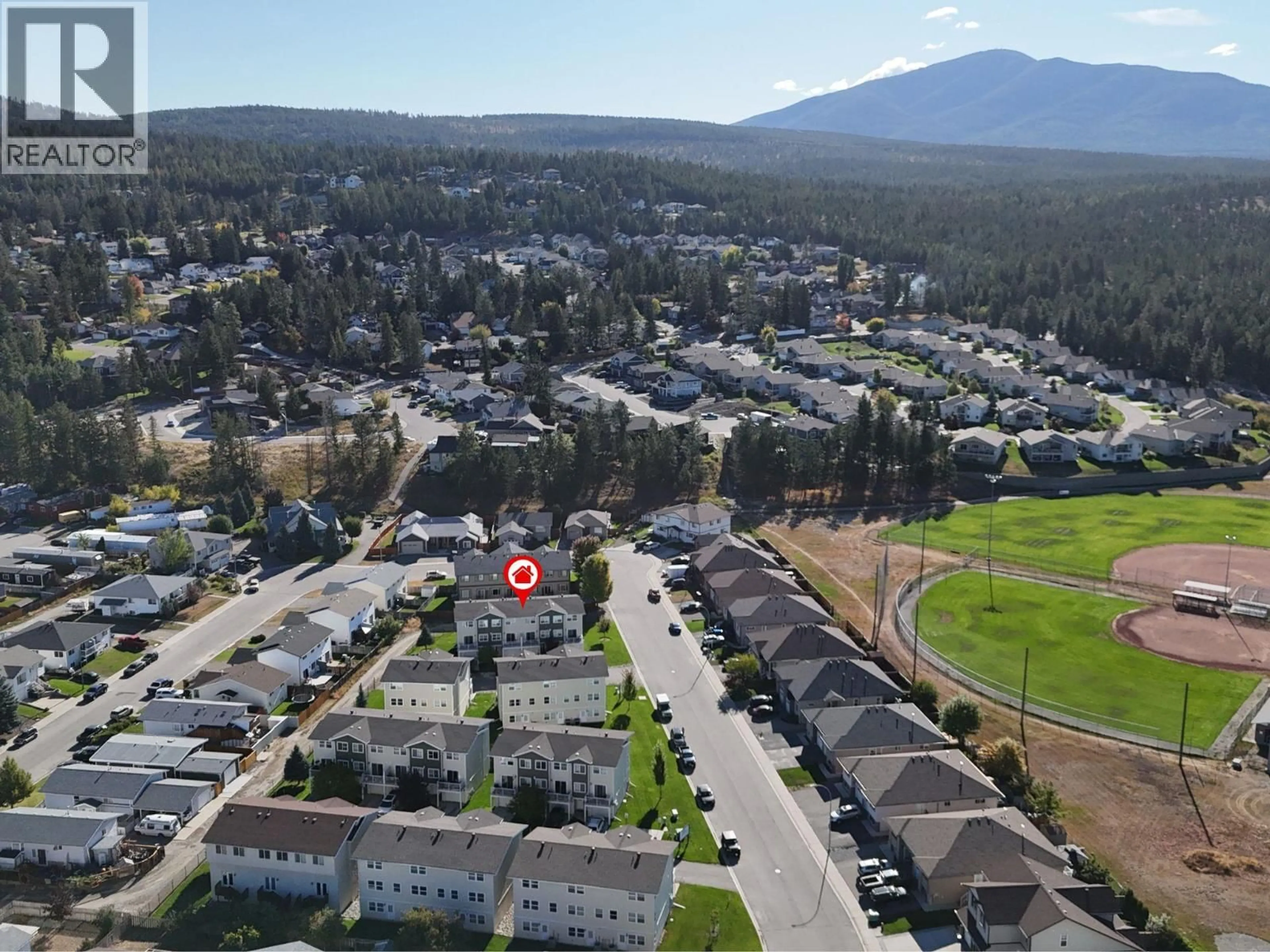 A pic from outside/outdoor area/front of a property/back of a property/a pic from drone, mountain view for 22 - 1840 KELOWNA CRESCENT, Cranbrook British Columbia V1C7A8