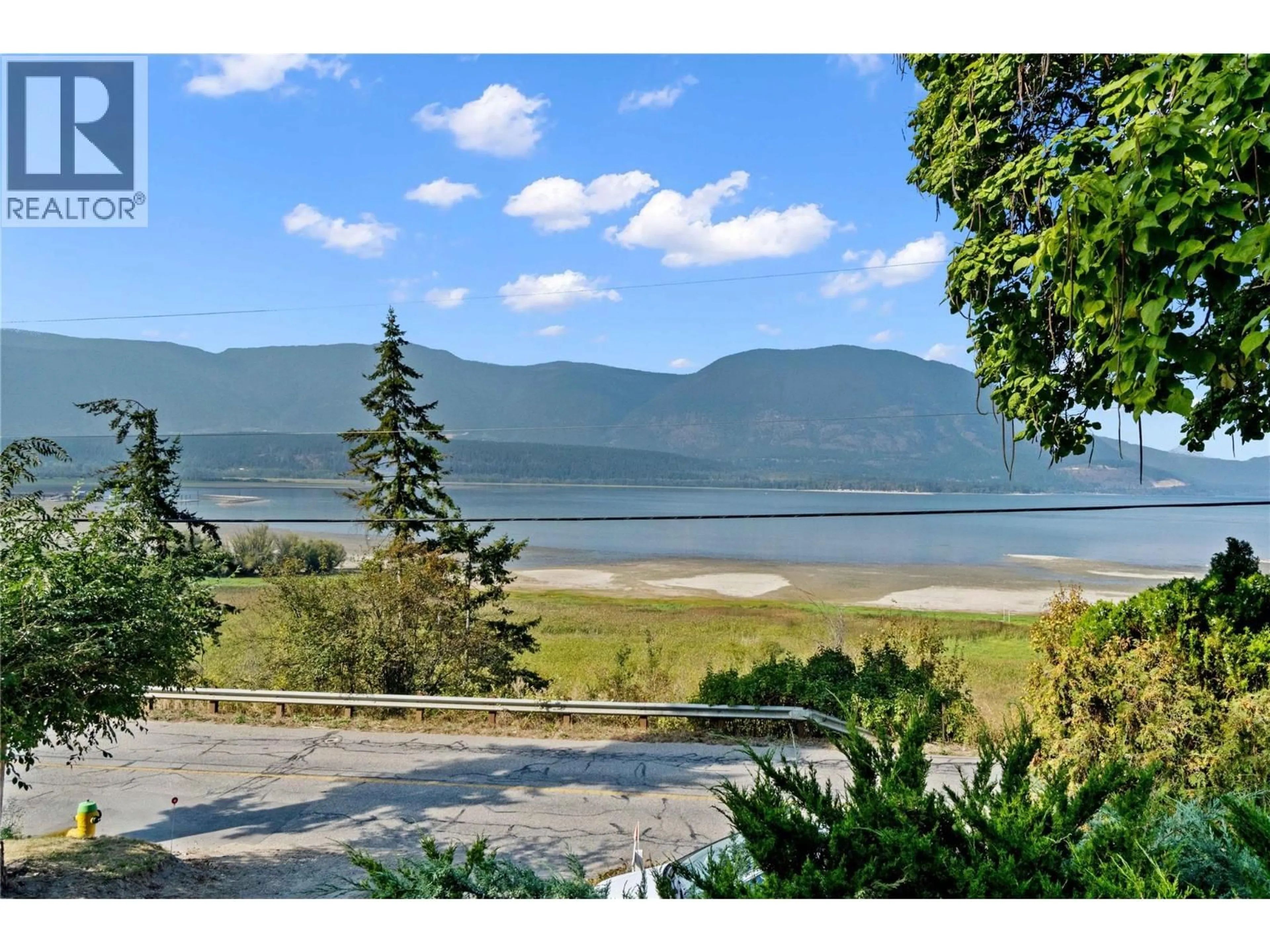 A pic from outside/outdoor area/front of a property/back of a property/a pic from drone, water/lake/river/ocean view for 1430 LAKESHORE ROAD NORTHEAST, Salmon Arm British Columbia V1E2V7