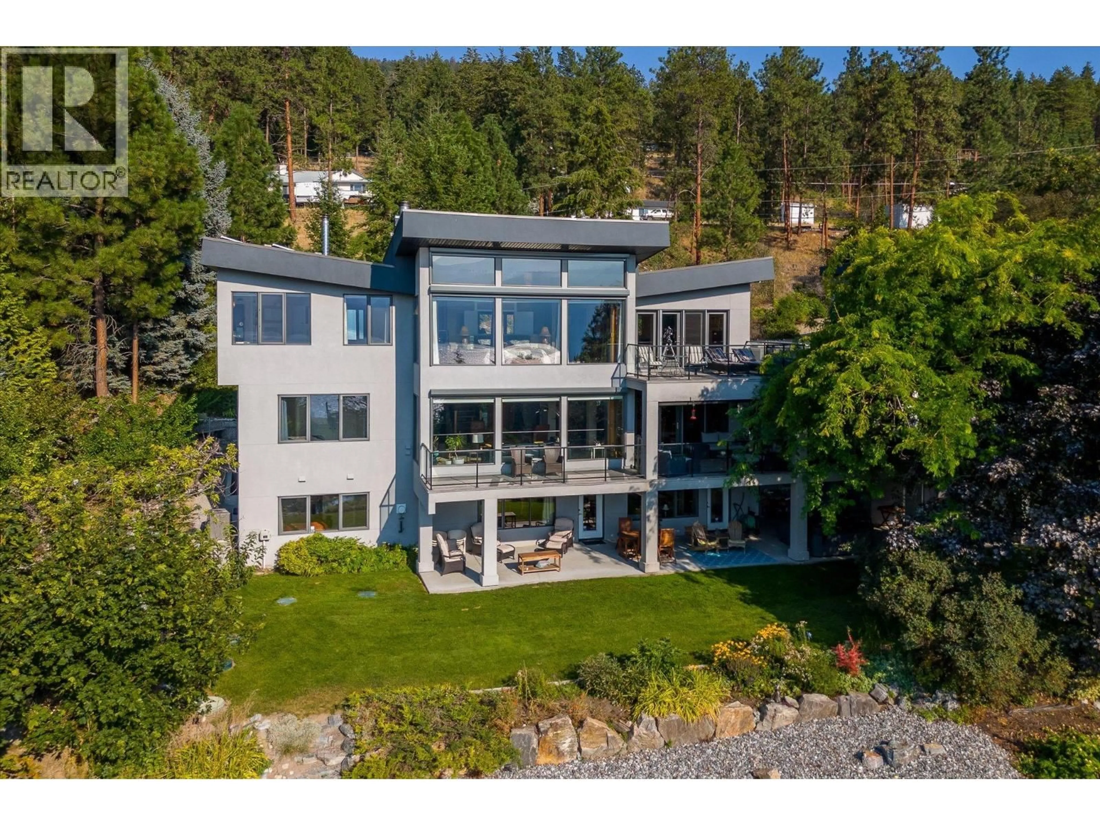 A pic from outside/outdoor area/front of a property/back of a property/a pic from drone, water/lake/river/ocean view for 16550 CARBONNEAU ROAD, Lake Country British Columbia V4V1B3