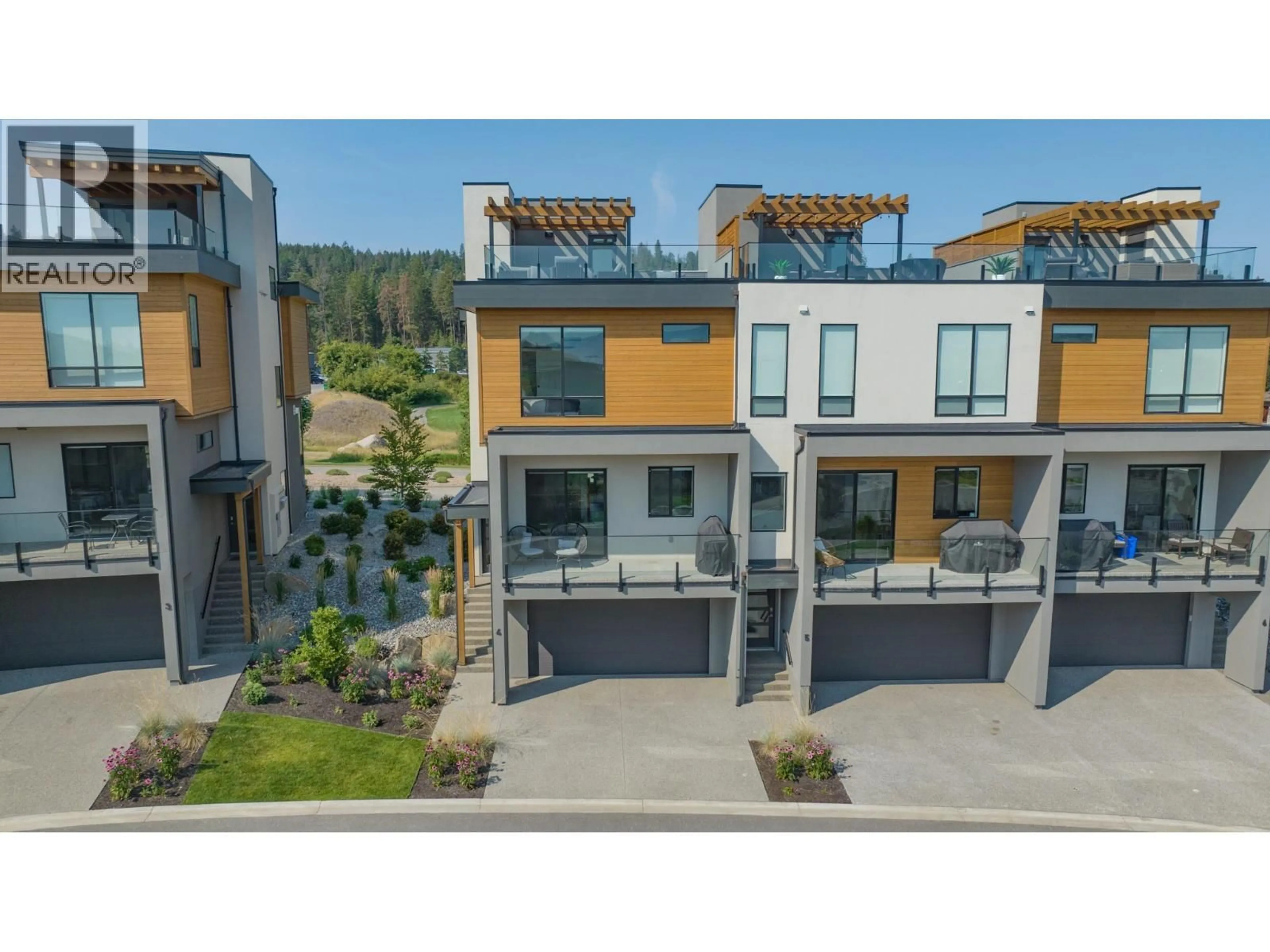 A pic from outside/outdoor area/front of a property/back of a property/a pic from drone, mountain view for 4 - 105 PREDATOR RIDGE DRIVE, Vernon British Columbia V1H0A5