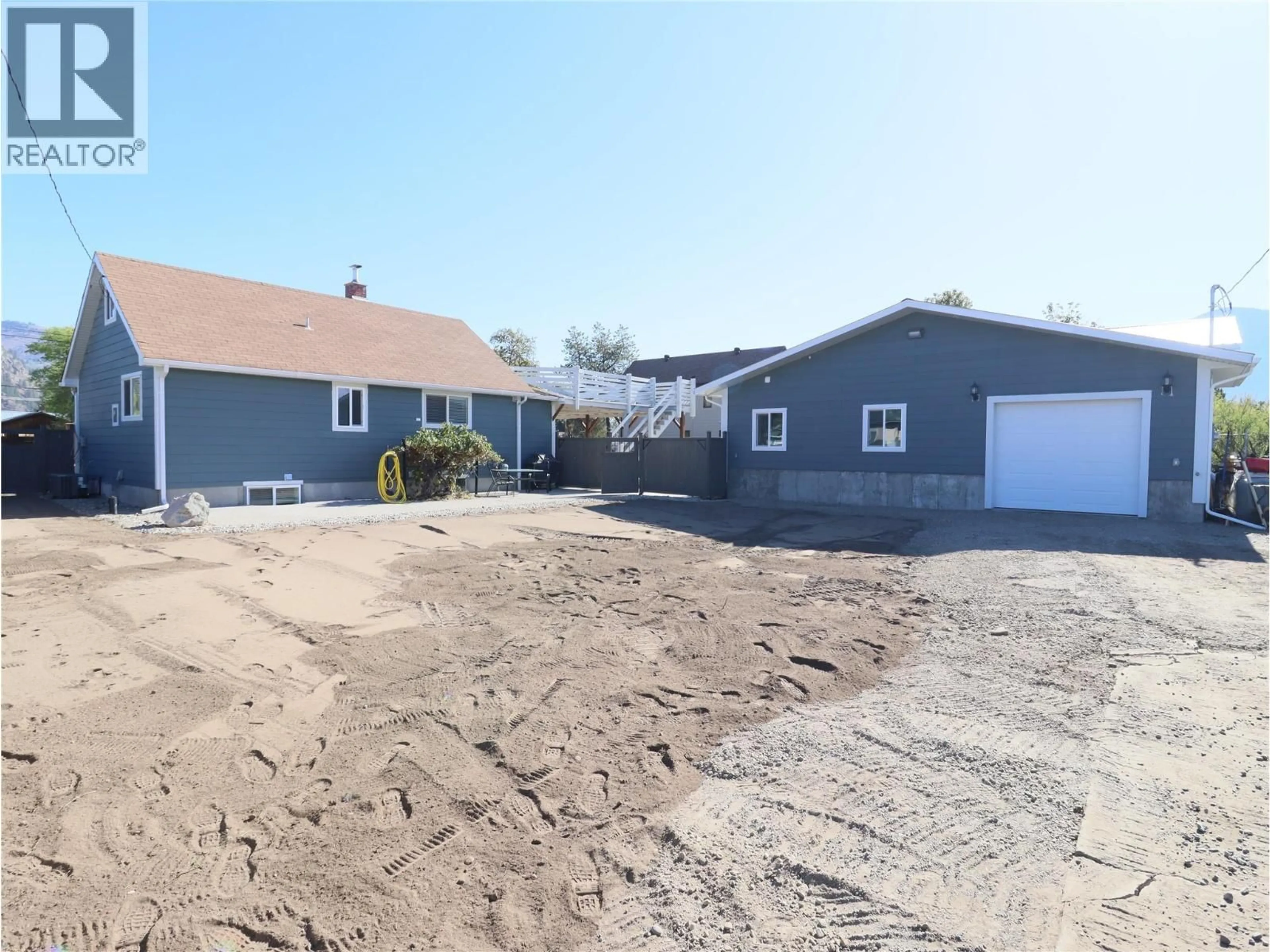 A pic from outside/outdoor area/front of a property/back of a property/a pic from drone, street for 7689 21ST STREET, Grand Forks British Columbia V0H1H2