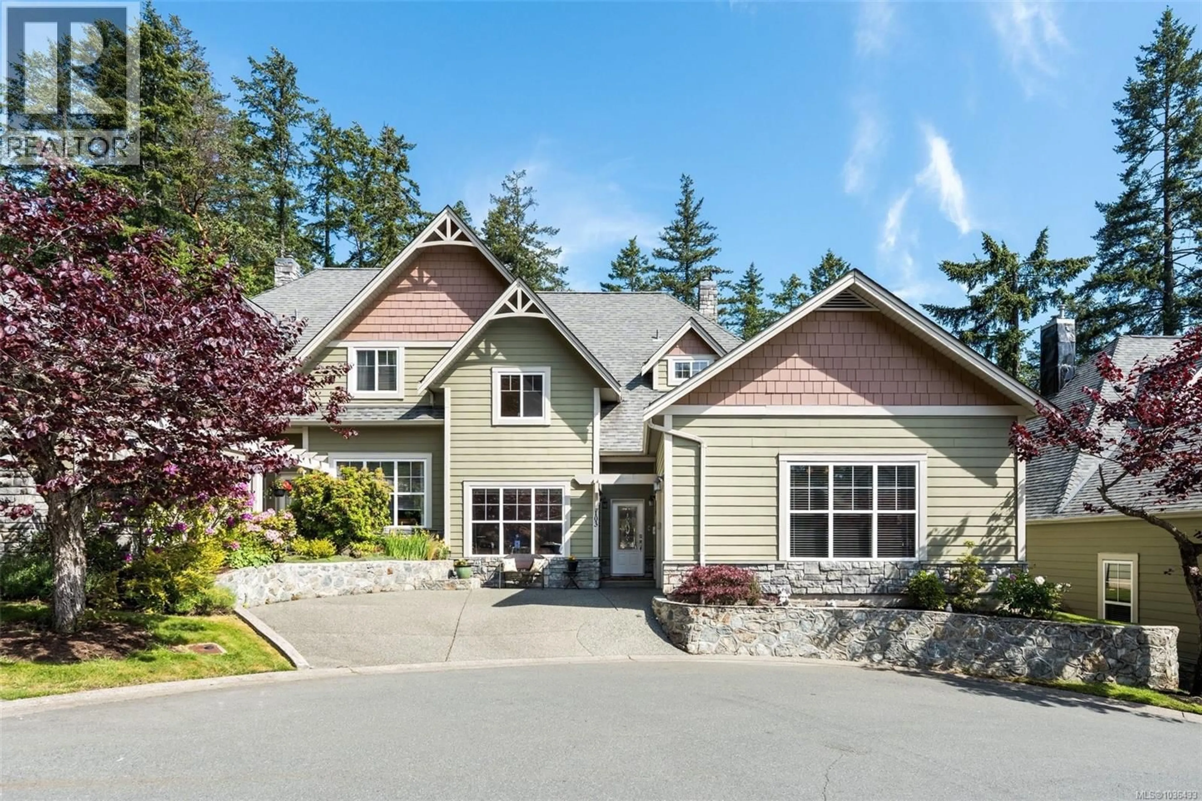 Home with vinyl exterior material, street for 103 - 945 BEAR MOUNTAIN PARKWAY, Langford British Columbia V9B6T1