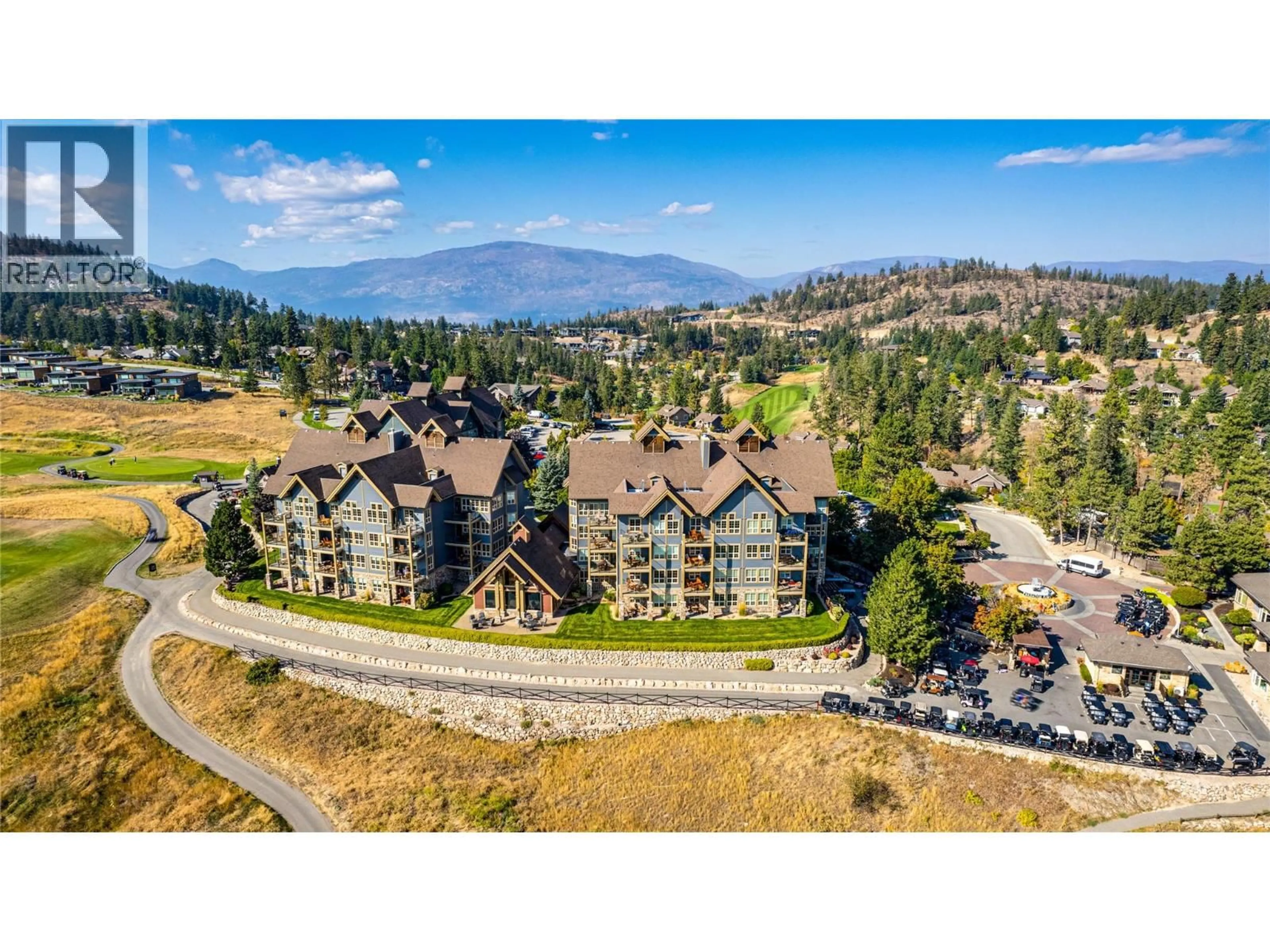 A pic from outside/outdoor area/front of a property/back of a property/a pic from drone, mountain view for 414 - 107 VILLAGE CENTRE COURT, Vernon British Columbia V1H1Y8