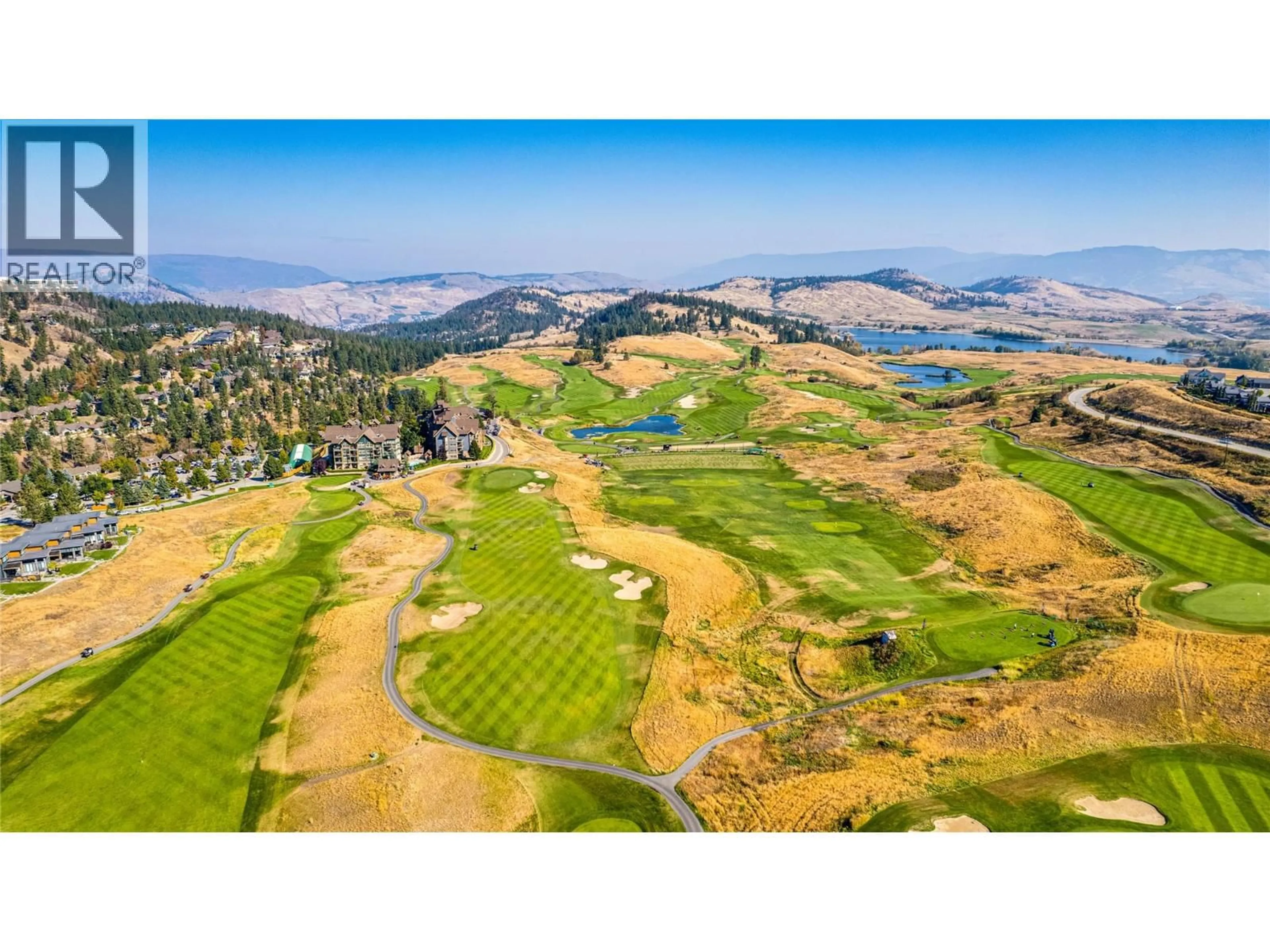 A pic from outside/outdoor area/front of a property/back of a property/a pic from drone, mountain view for 414 - 107 VILLAGE CENTRE COURT, Vernon British Columbia V1H1Y8