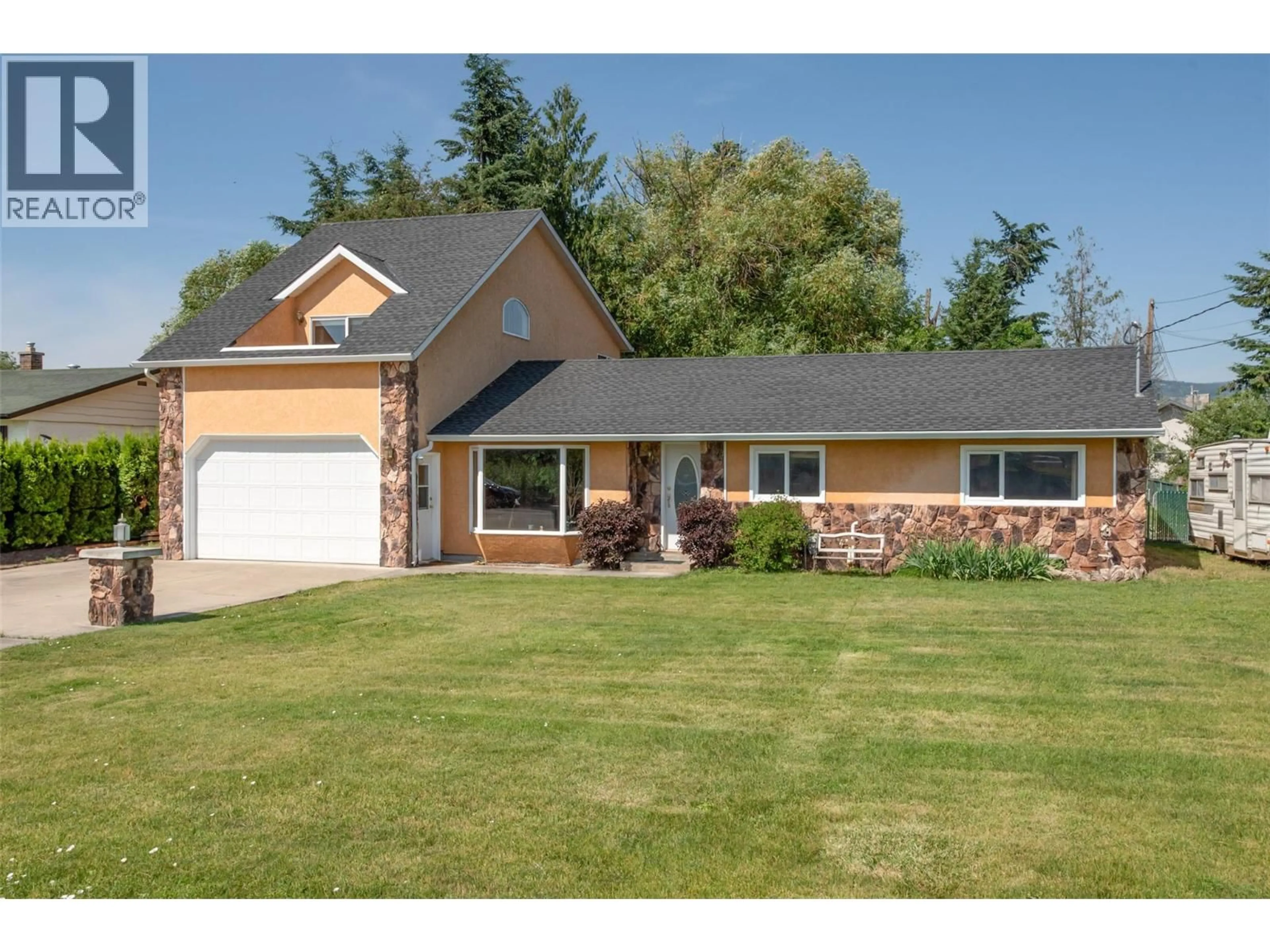Home with vinyl exterior material, street for 3982 HITCHNER ROAD, West Kelowna British Columbia V4T2C9