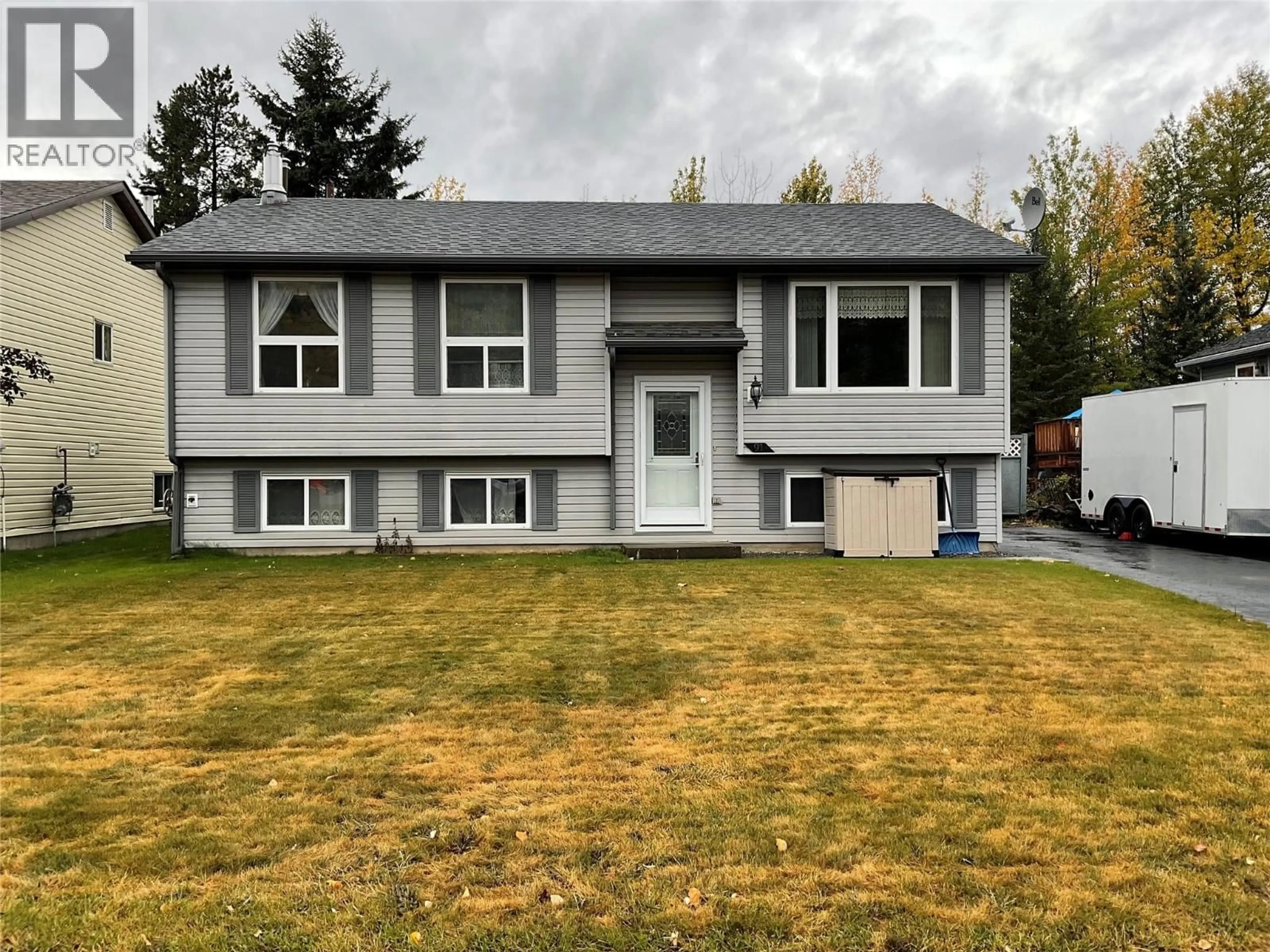 Home with vinyl exterior material, street for 91 WOLVERINE AVENUE, Tumbler Ridge British Columbia V0C2W0