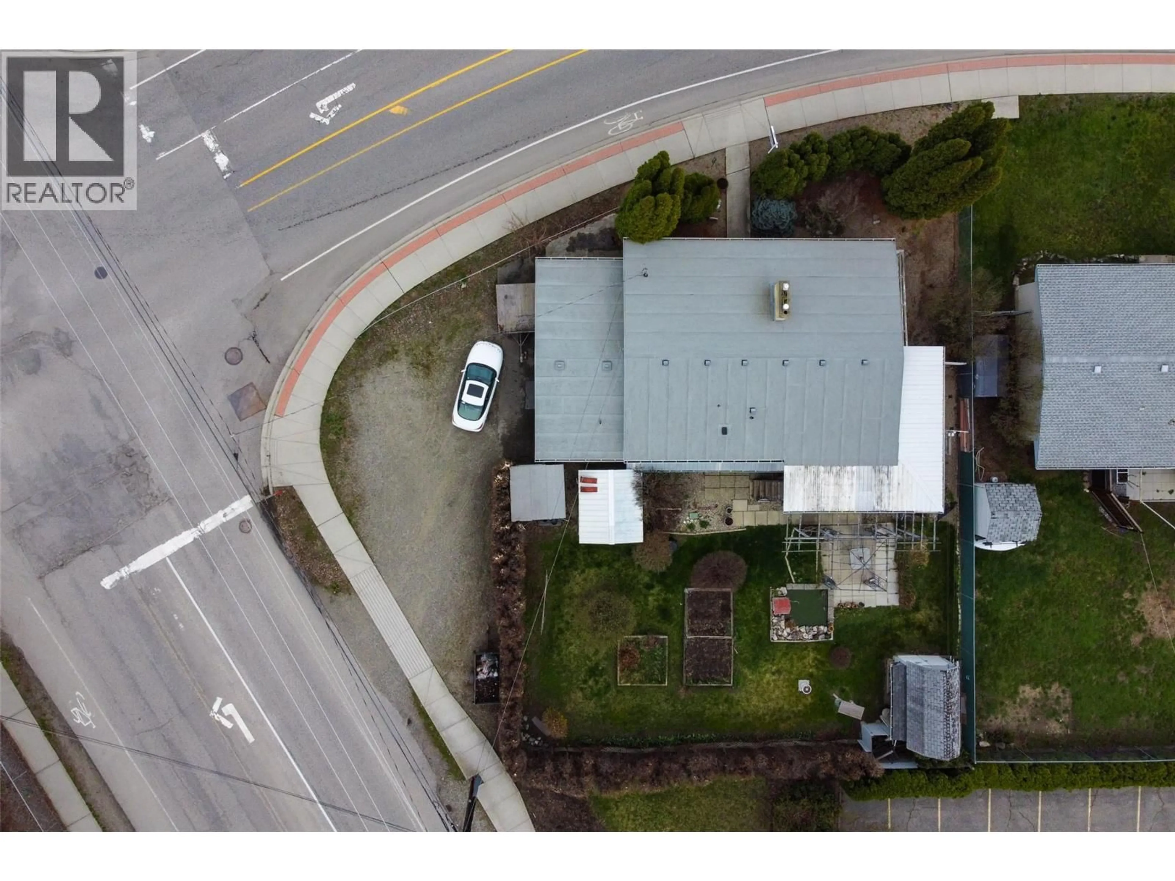 A pic from outside/outdoor area/front of a property/back of a property/a pic from drone, street for 1911 CROSS ROAD, Kelowna British Columbia V1V2E4