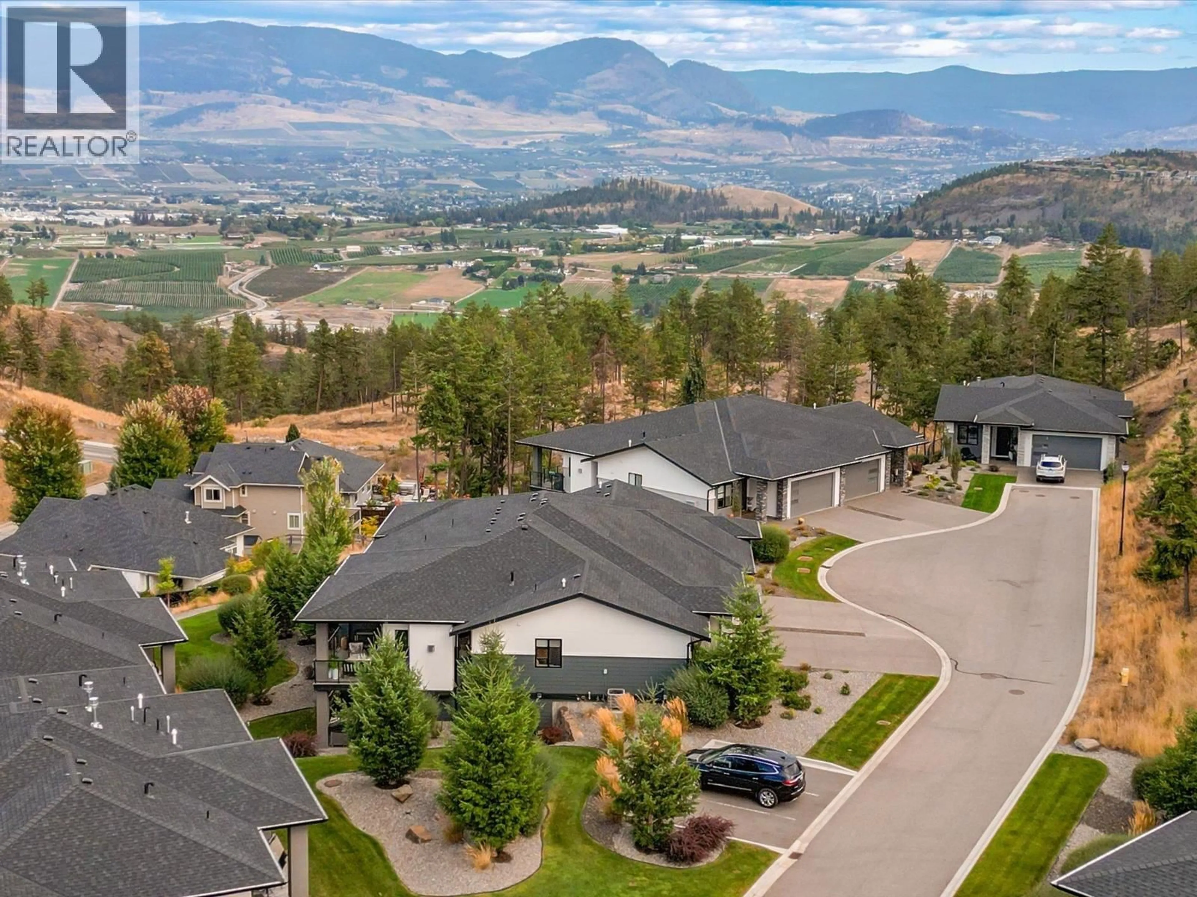 A pic from outside/outdoor area/front of a property/back of a property/a pic from drone, mountain view for 5 - 1349 ROCKY POINT DRIVE, Kelowna British Columbia V1V0B5