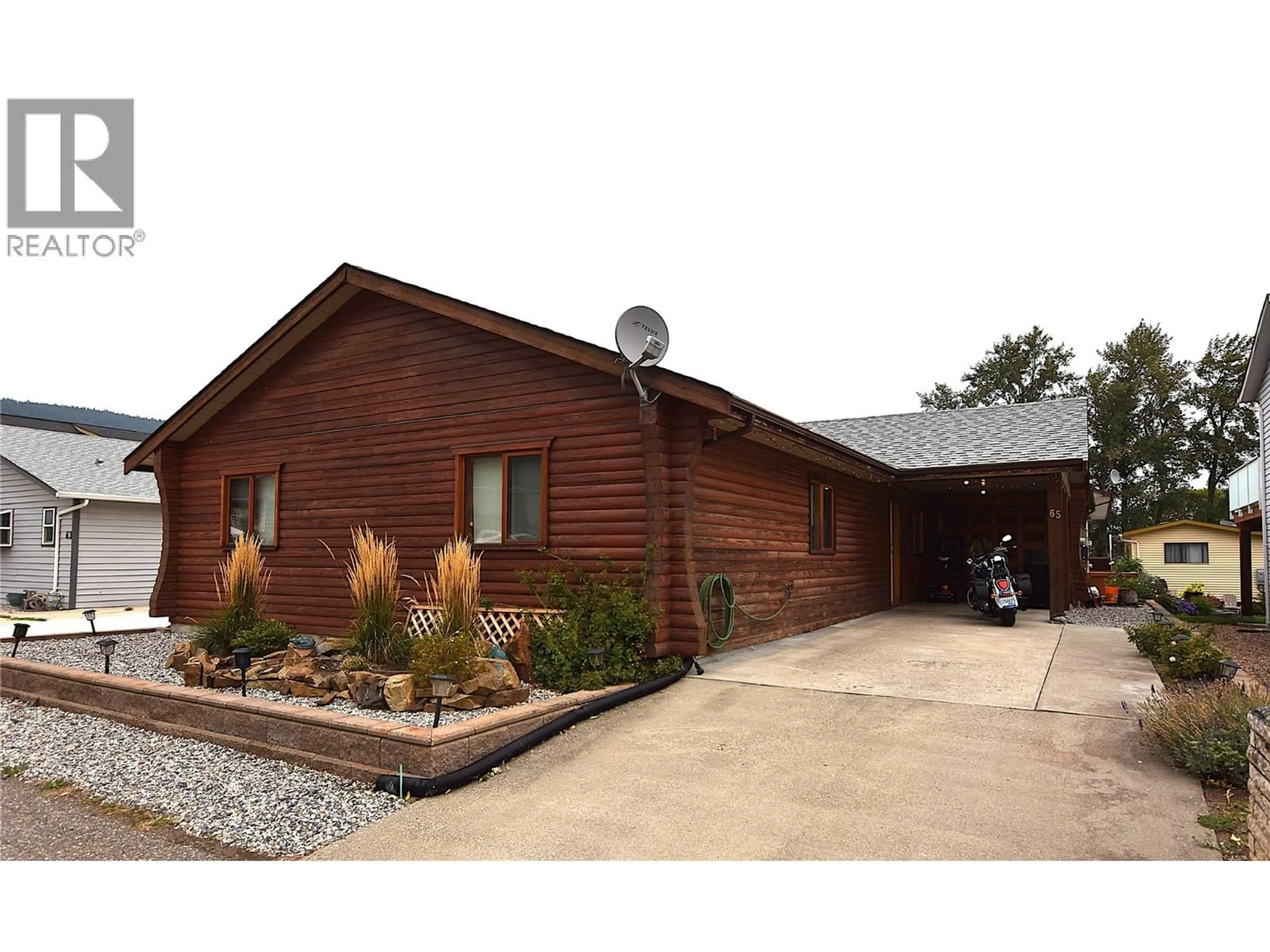 Home with brick exterior material, building for 65 ELK STREET, Vernon British Columbia V1H2A1
