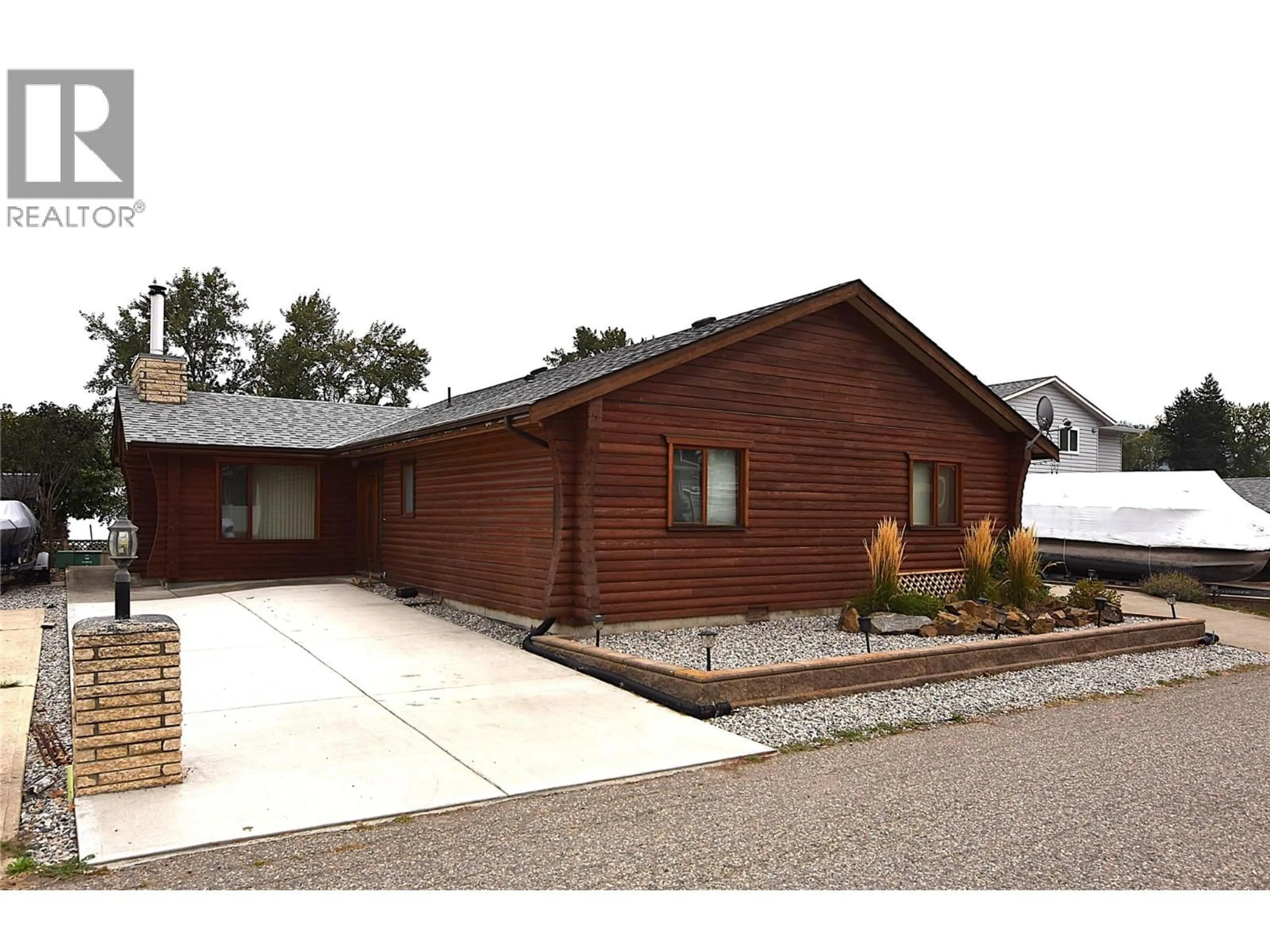 Home with brick exterior material, building for 65 ELK STREET, Vernon British Columbia V1H2A1